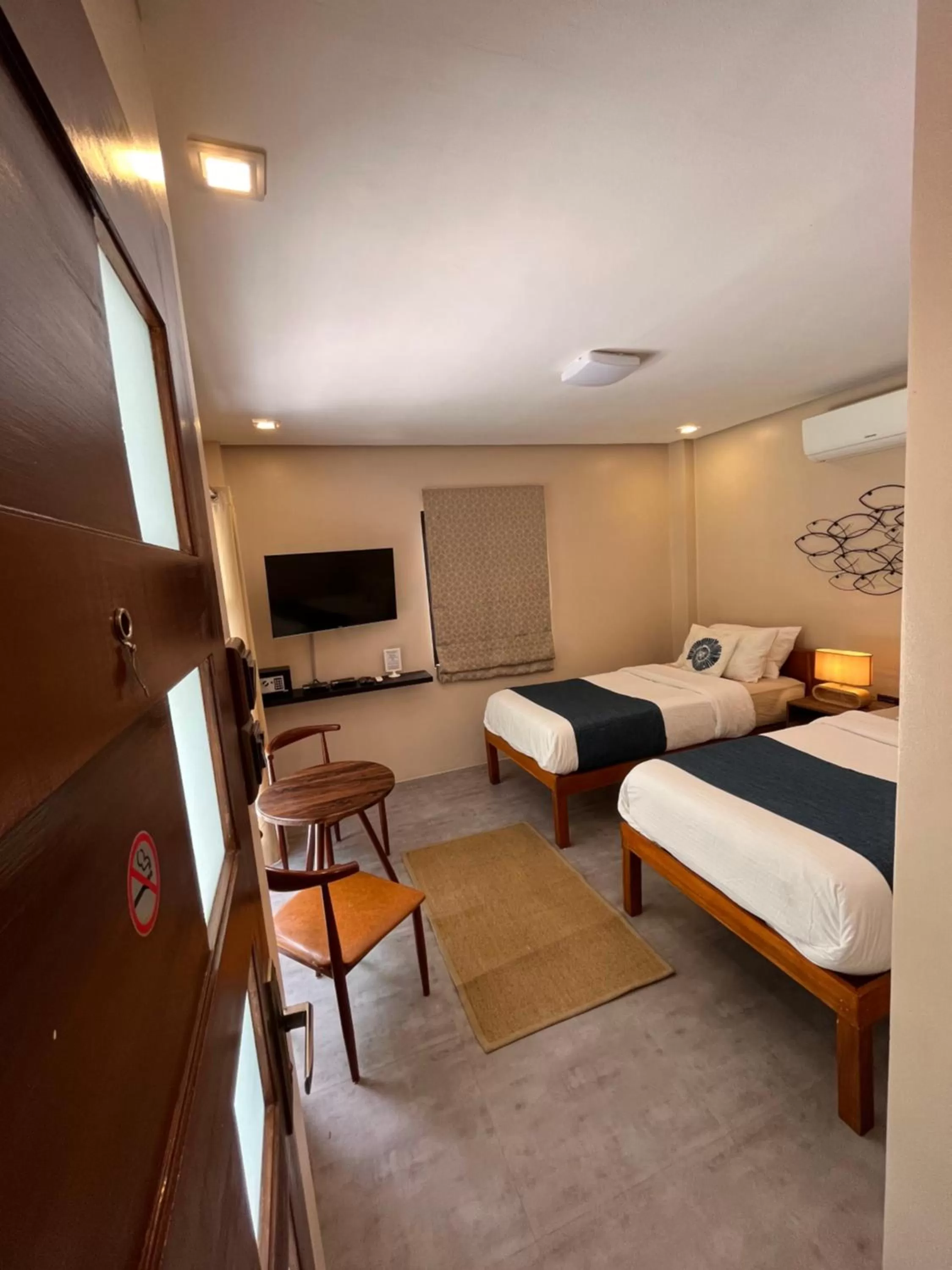 Bed in Southseas Beach Resort and Dive Center