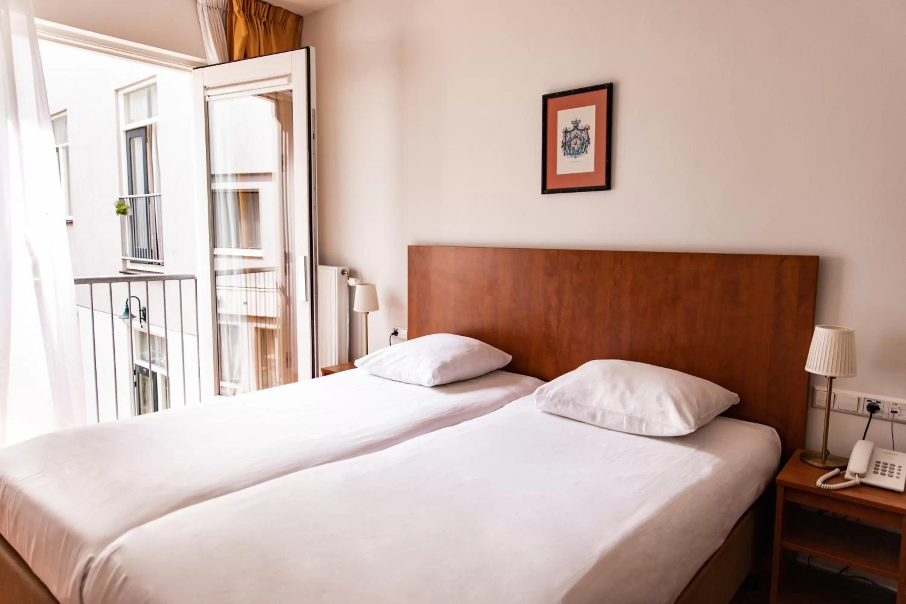 Bed in Ambassador City Centre Hotel