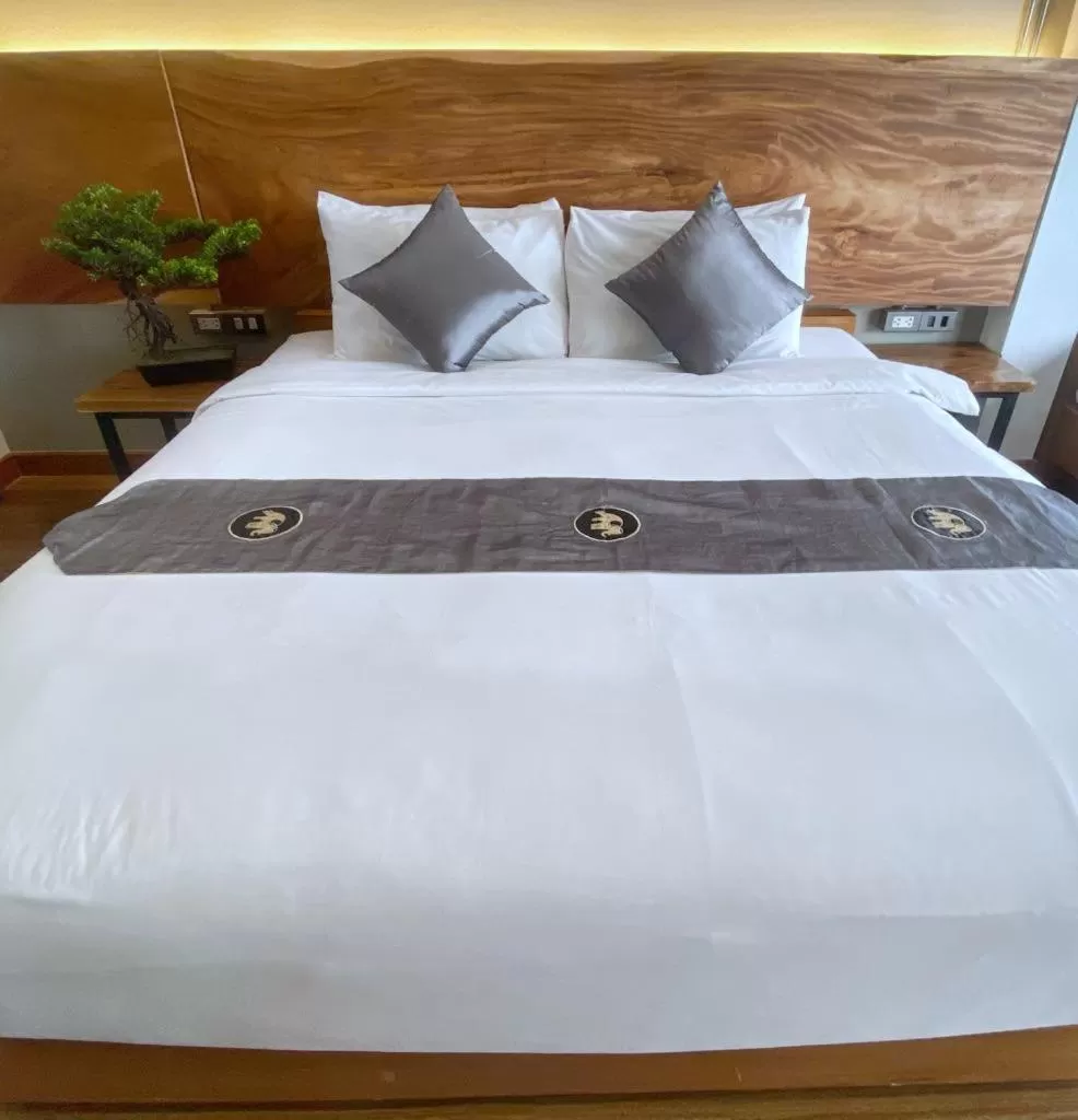 Bed in Lanna Tree Boutique Hotel
