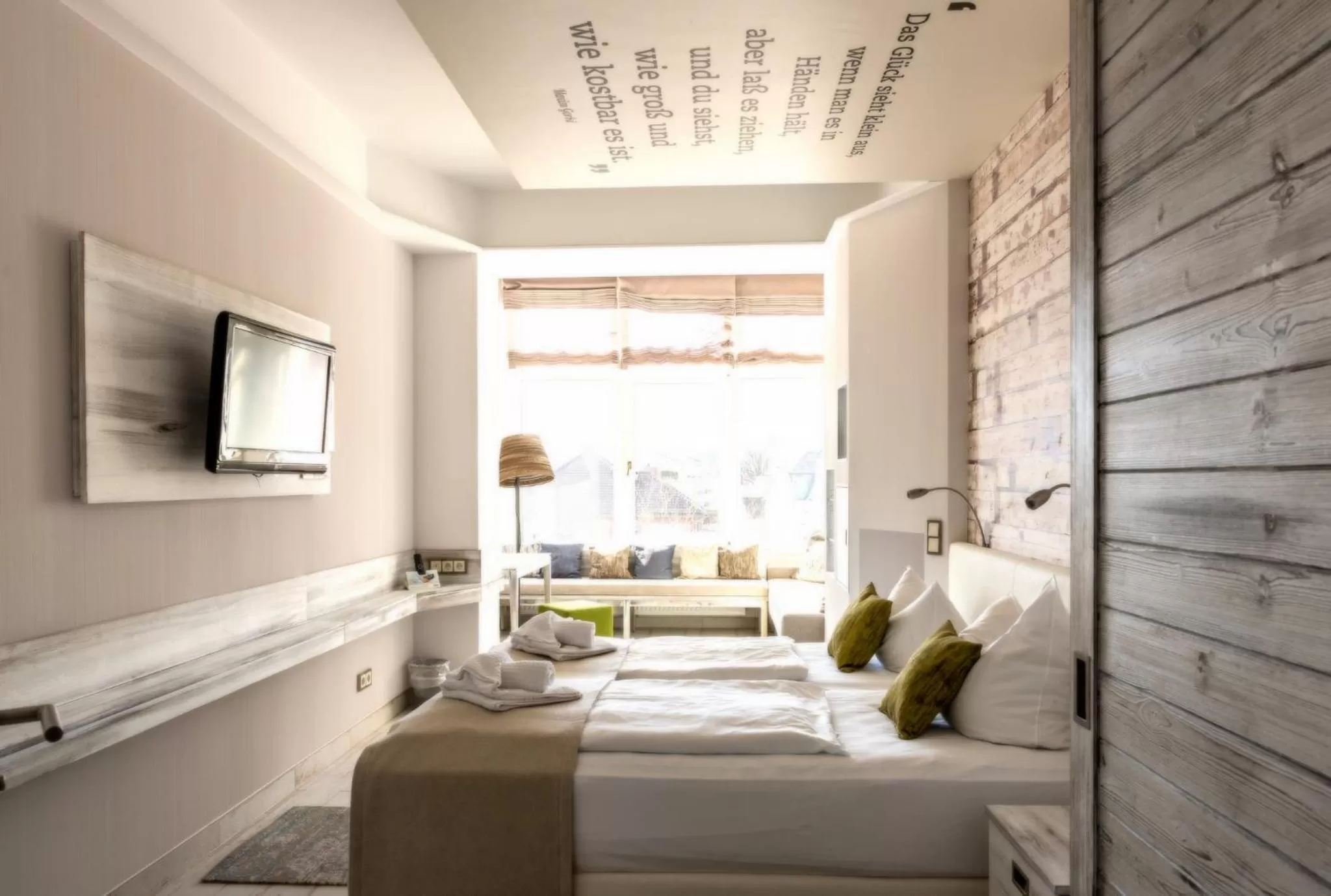 Photo of the whole room, Bed in SEETELHOTEL Strandhotel Atlantic das Boutiquehotel am Meer