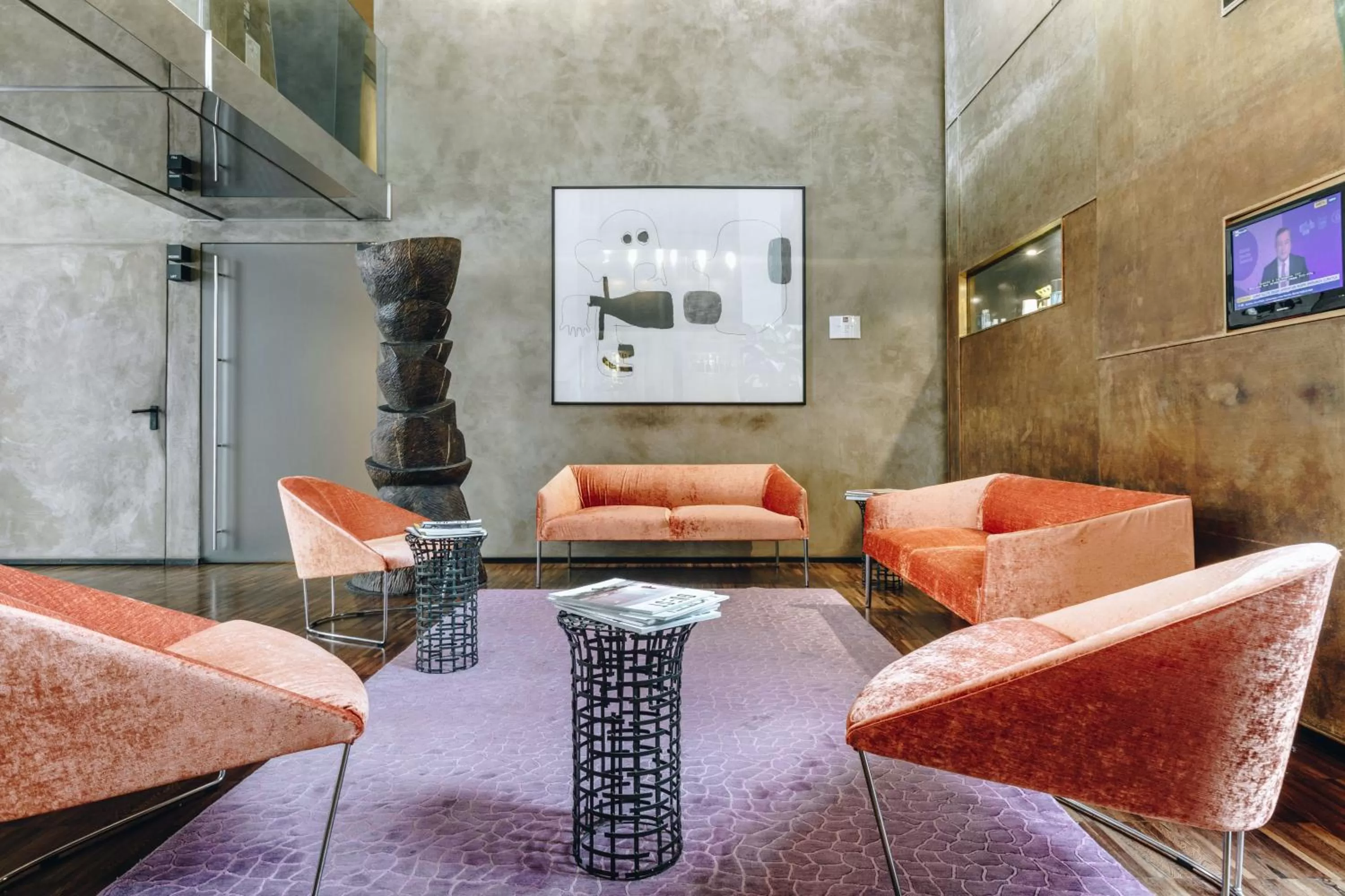 Communal lounge/ TV room in DelleArti Design Hotel
