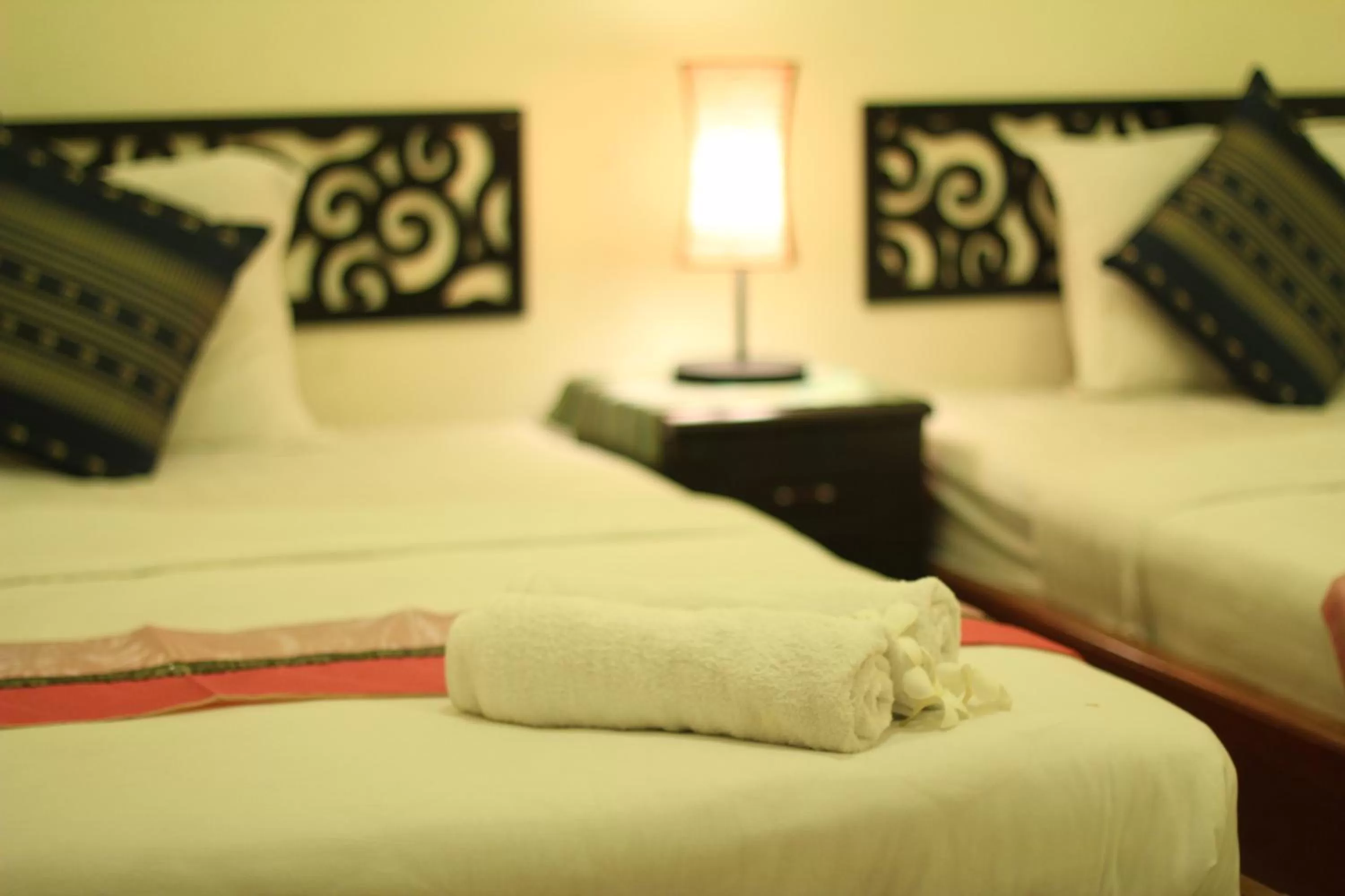 Bed in New Season Riverside Hotel