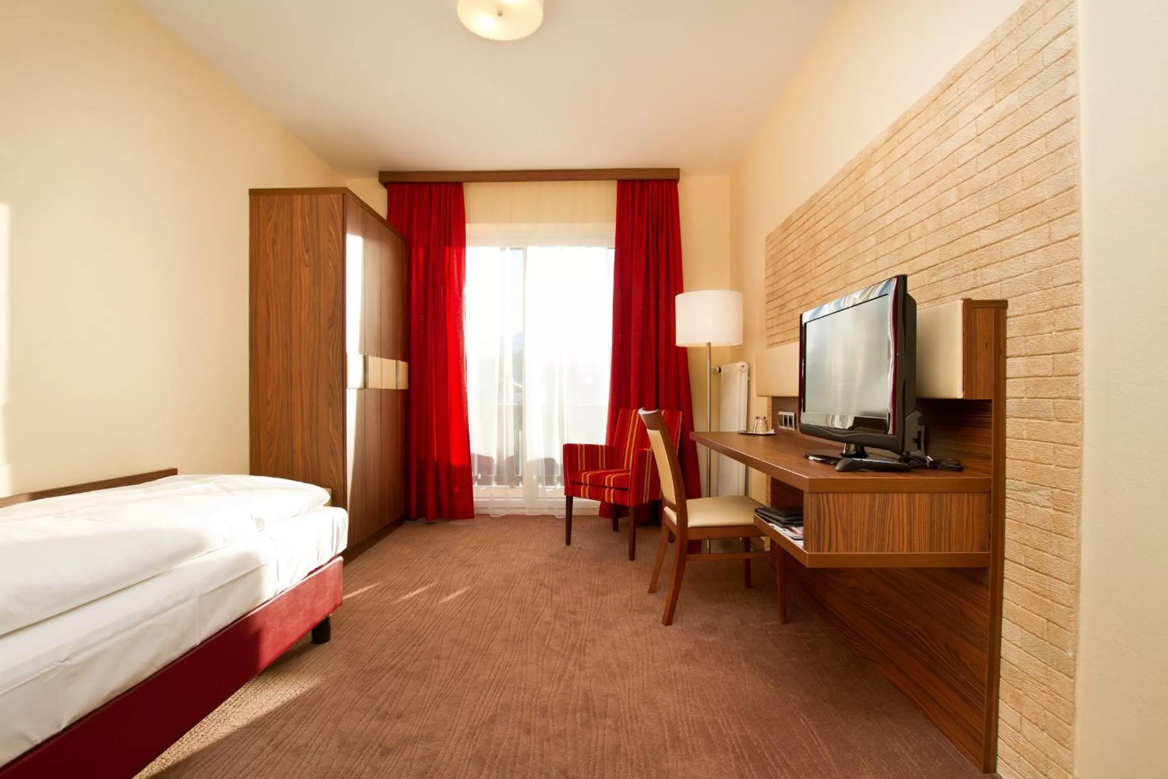 Bedroom, TV/Entertainment Center in SCHÖNIS-Landhotel