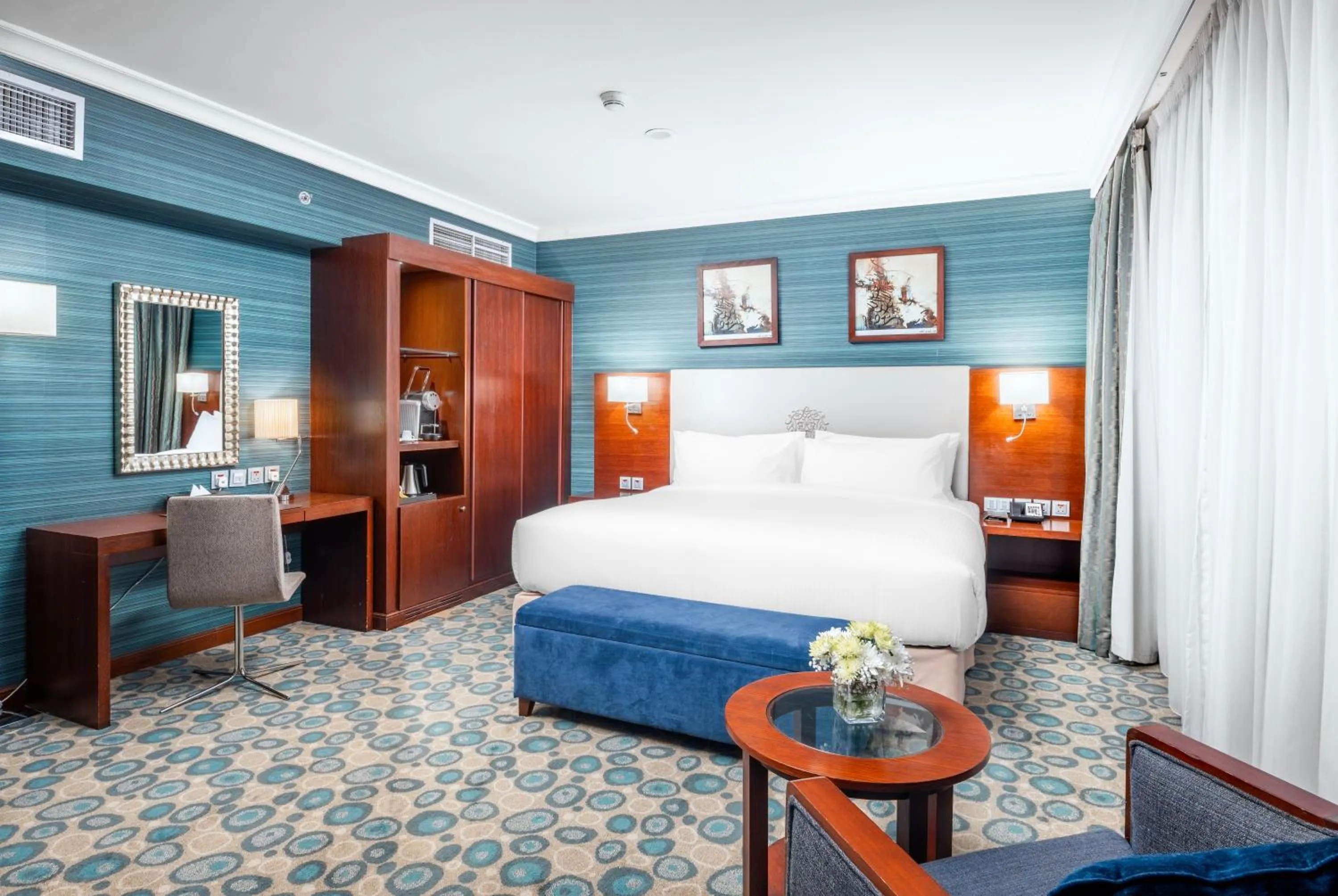 Bed in Millennium Al Aqeeq Hotel