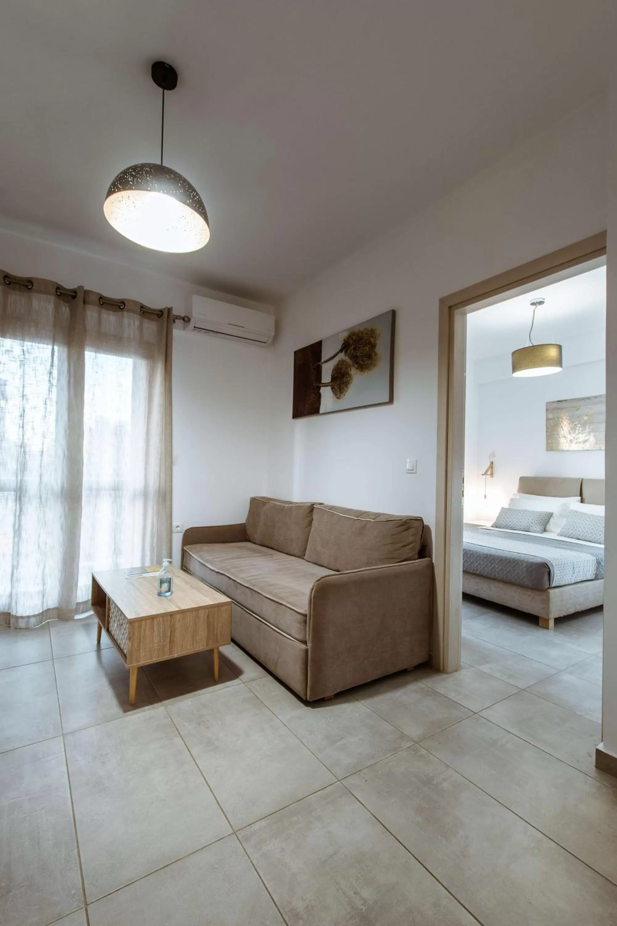 Living room, Bed in Deluxe Hotel