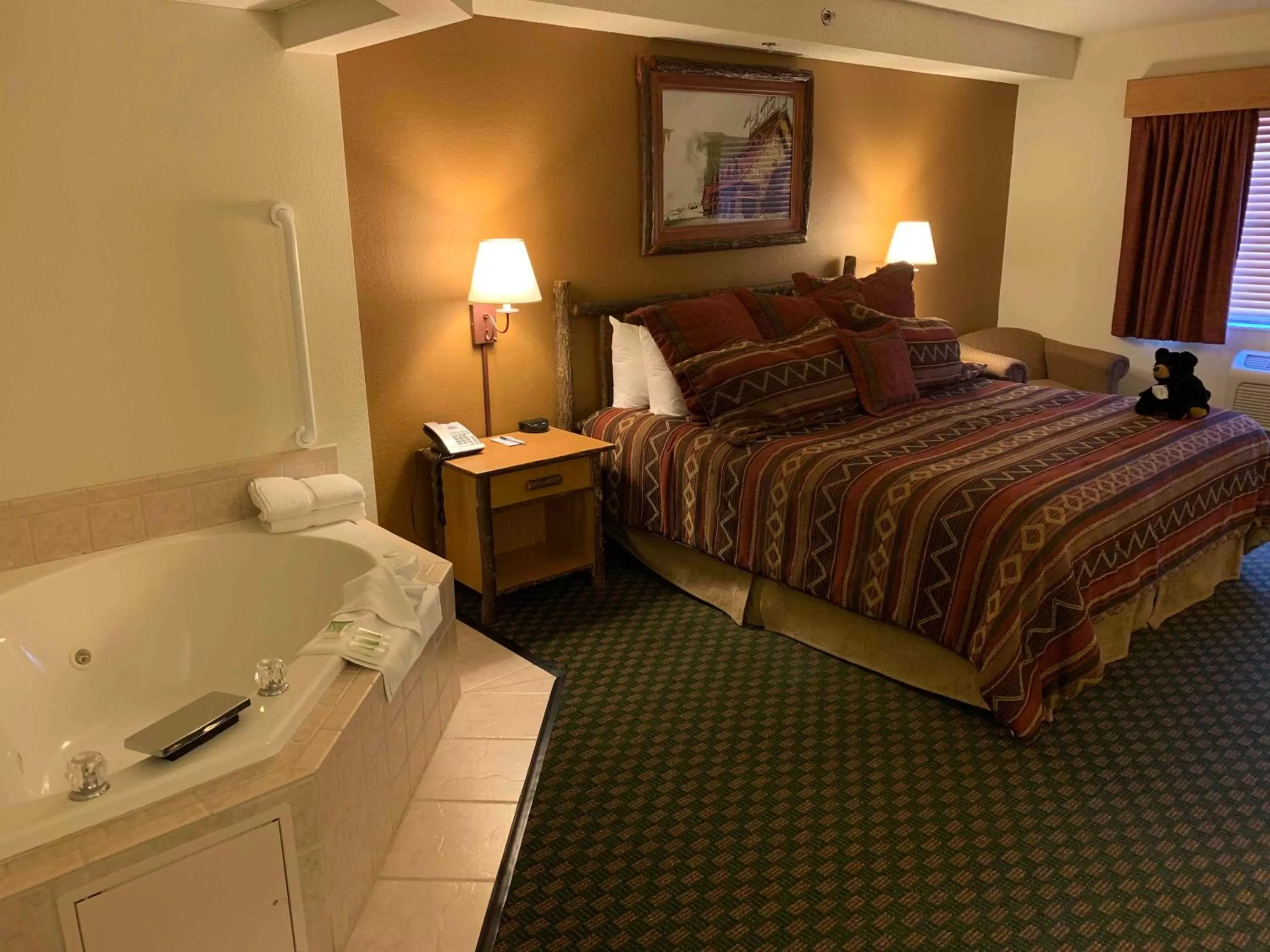 Bed in AmericInn by Wyndham Cody