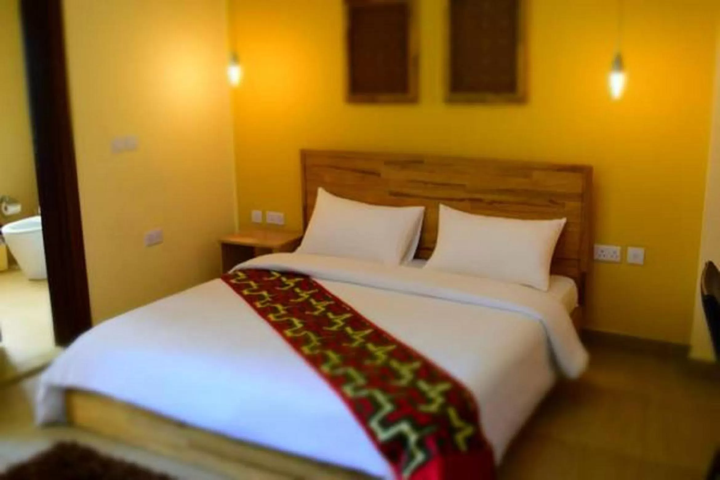 Bed in Roots Hotel Apartment