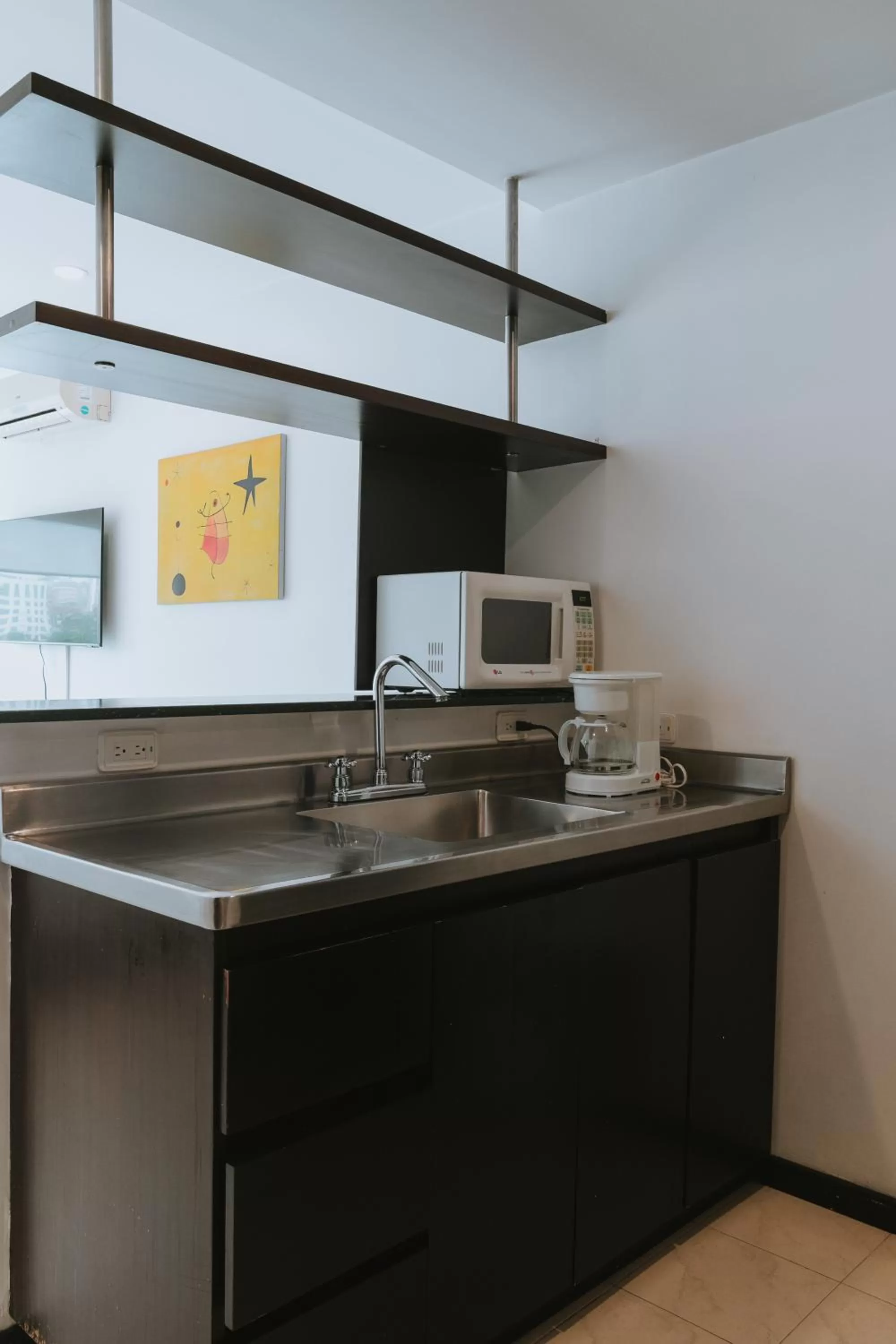 kitchen in Travelers Orange Suites