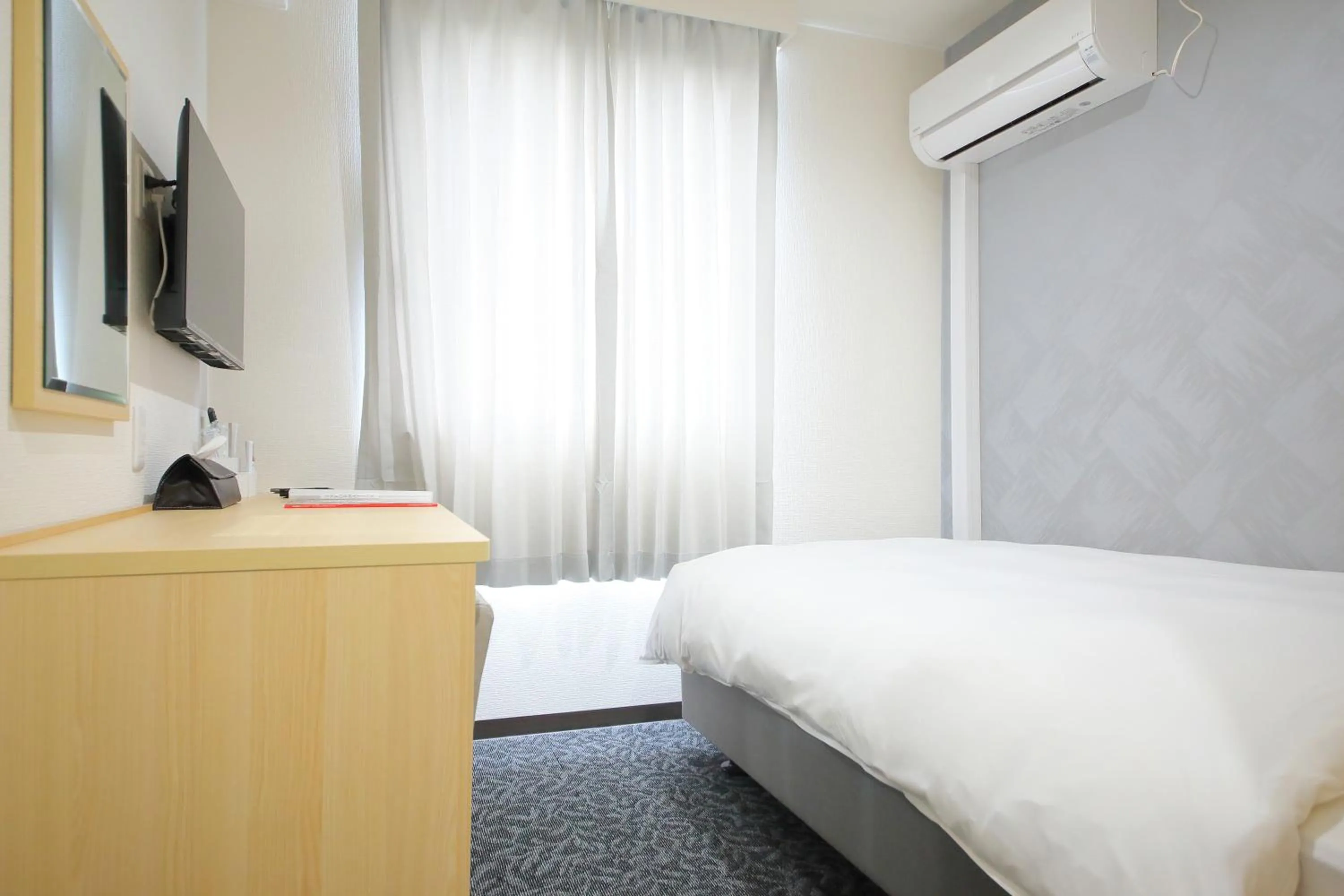 Bed in Hotel Shin-Imamiya