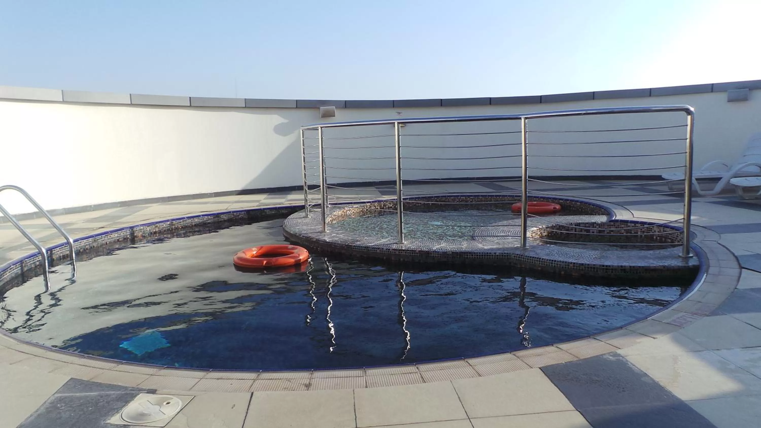 Swimming pool in Xclusive Maples Hotel Apartment