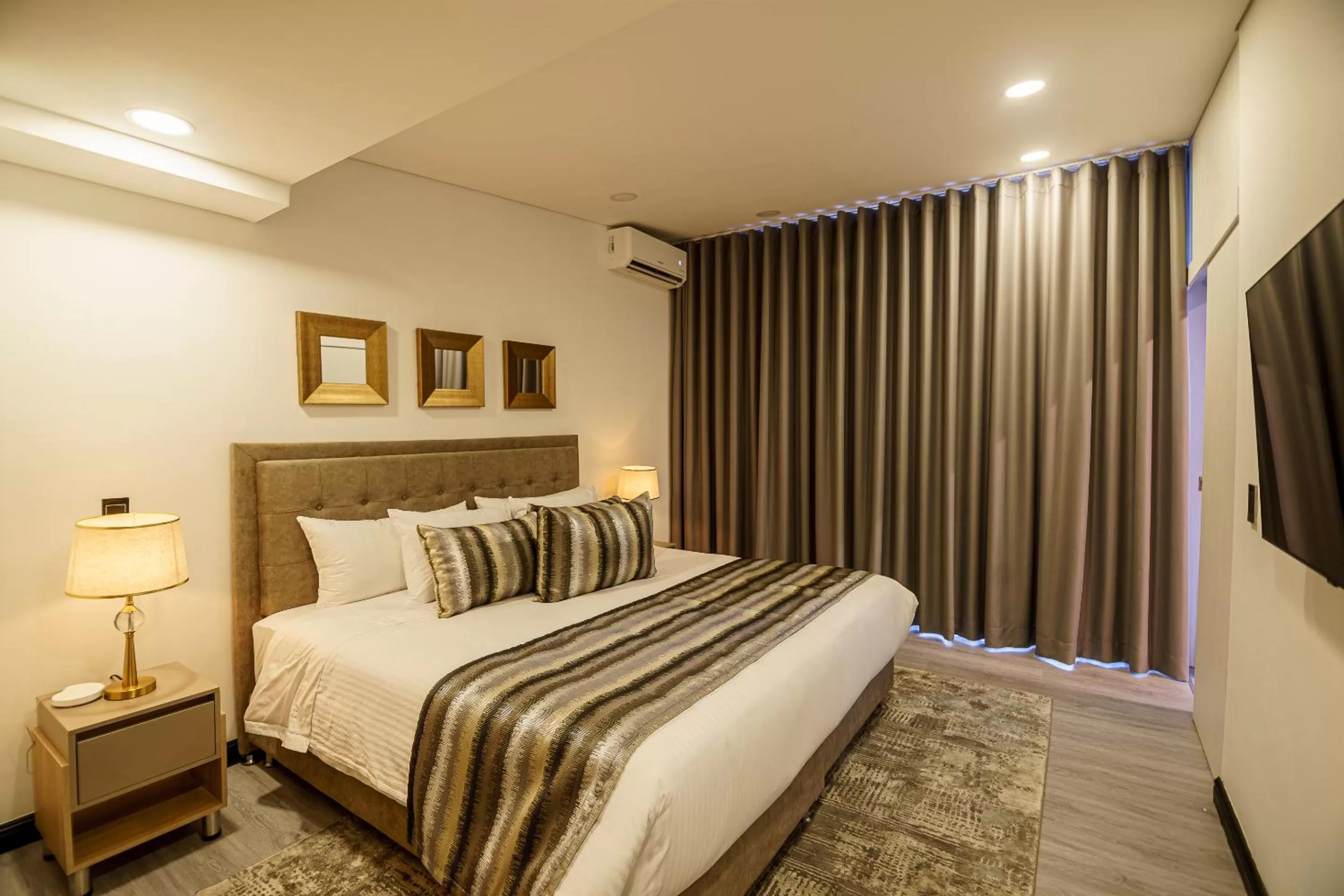 Photo of the whole room, Bed in First Class Hotel