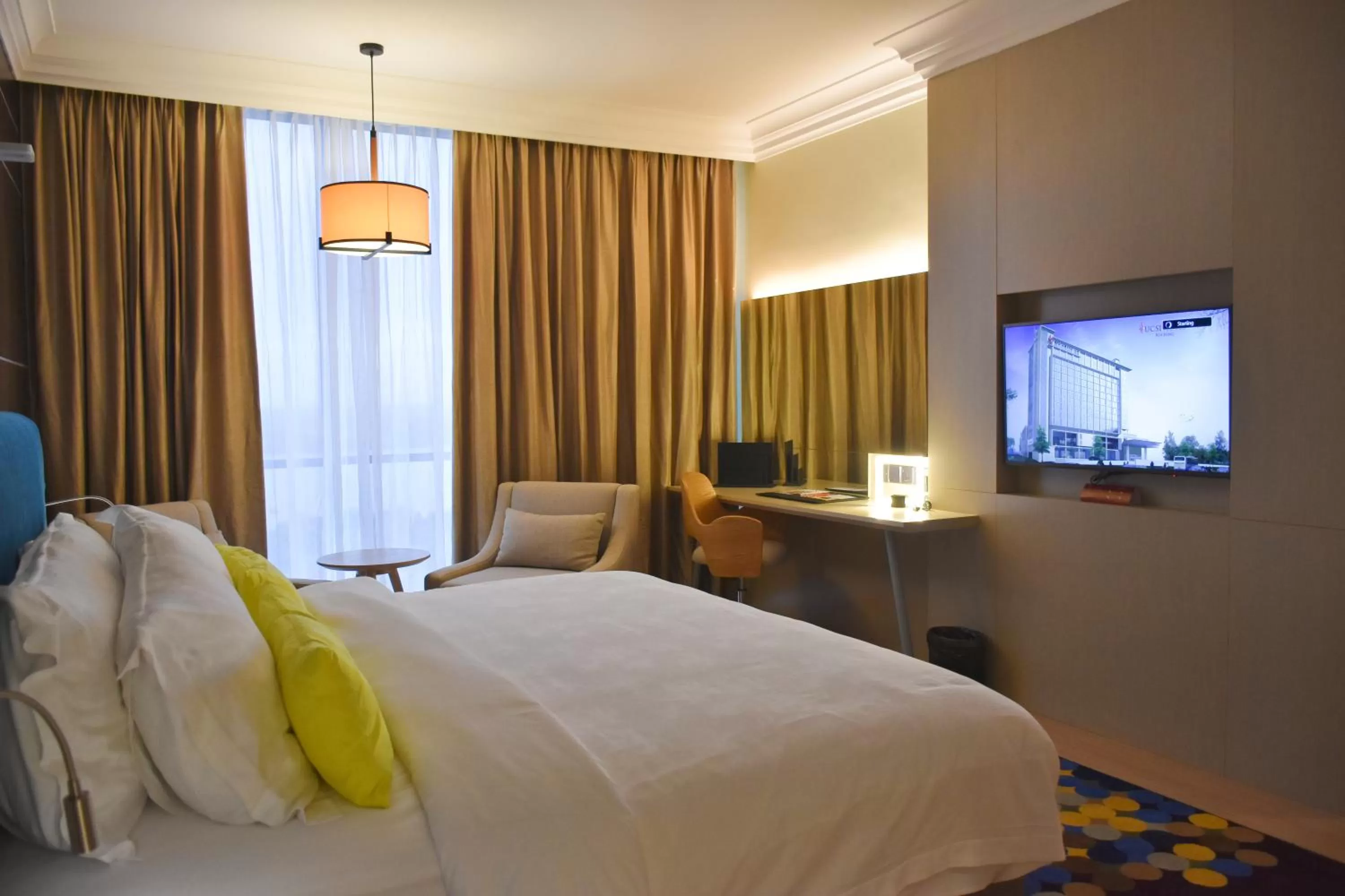 Communal lounge/ TV room, Bed in UCSI Hotel Kuching