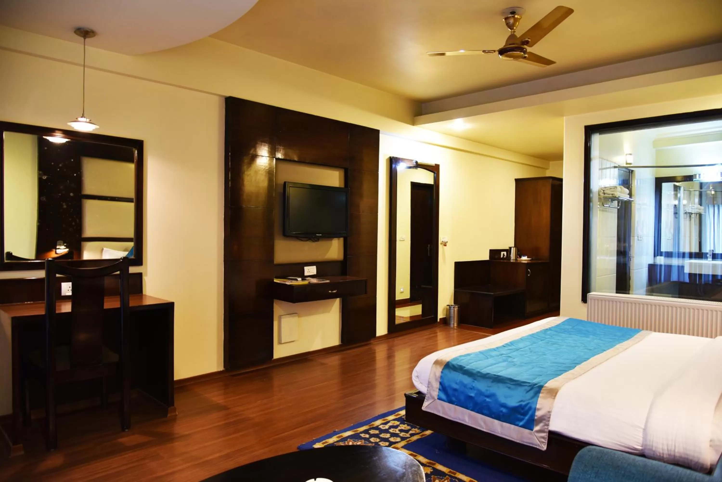 TV and multimedia, Bed in Indraprastha Resort - Centrally Heated Rooms, with Gym, Games & Spa