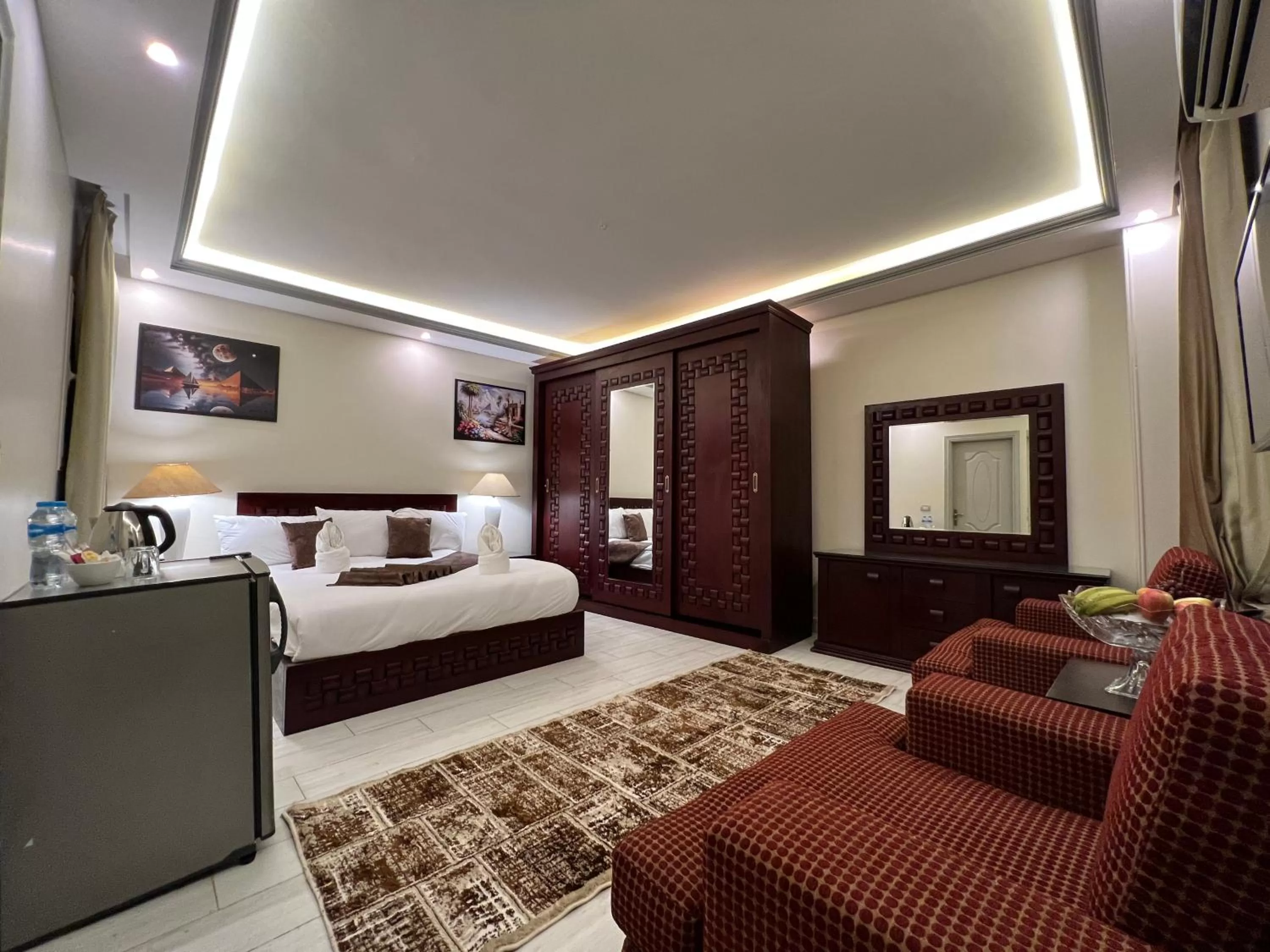 Bed, Seating Area in The Muse Pyramids