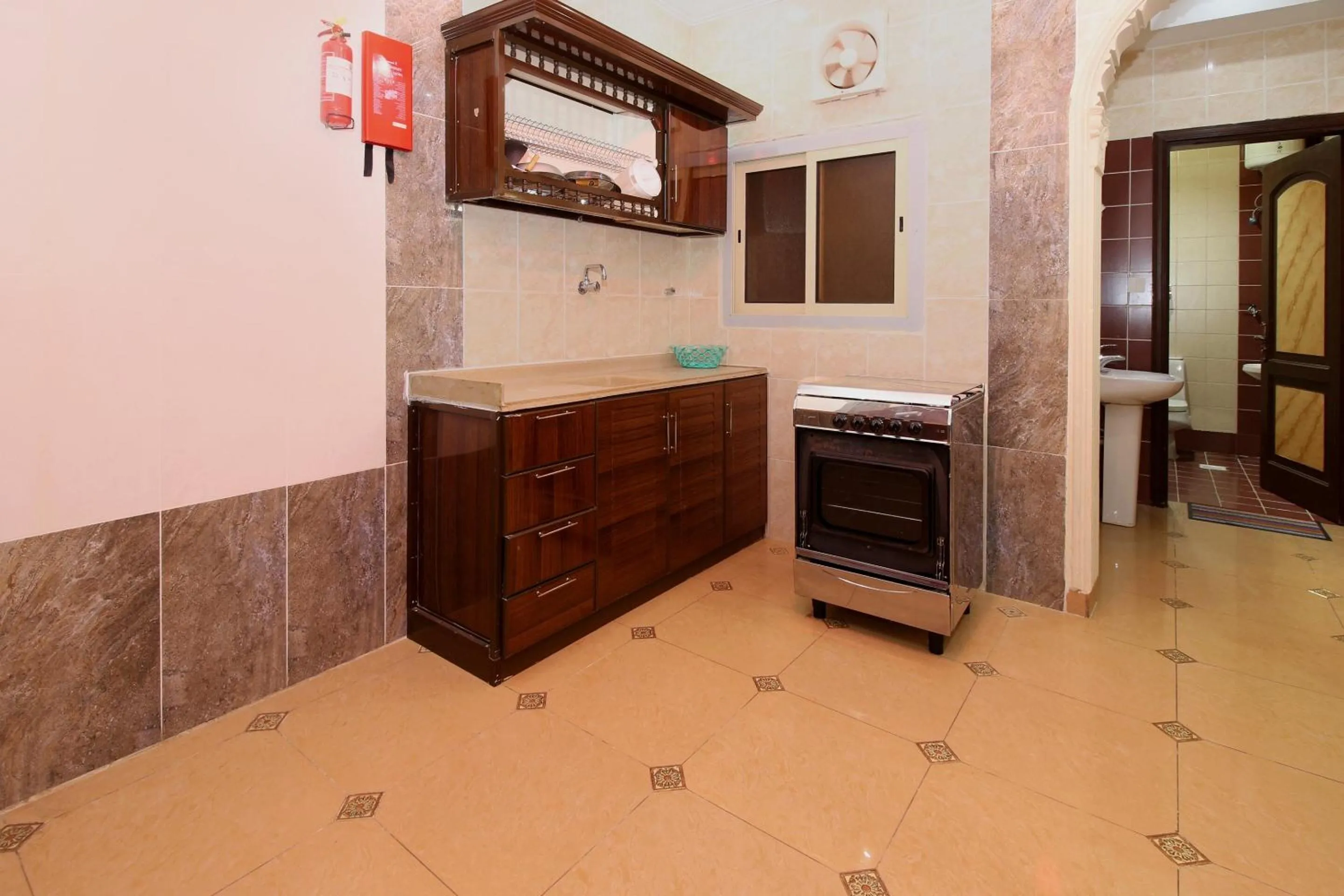 Bedroom, Kitchen/Kitchenette in OYO 589 Lavina House