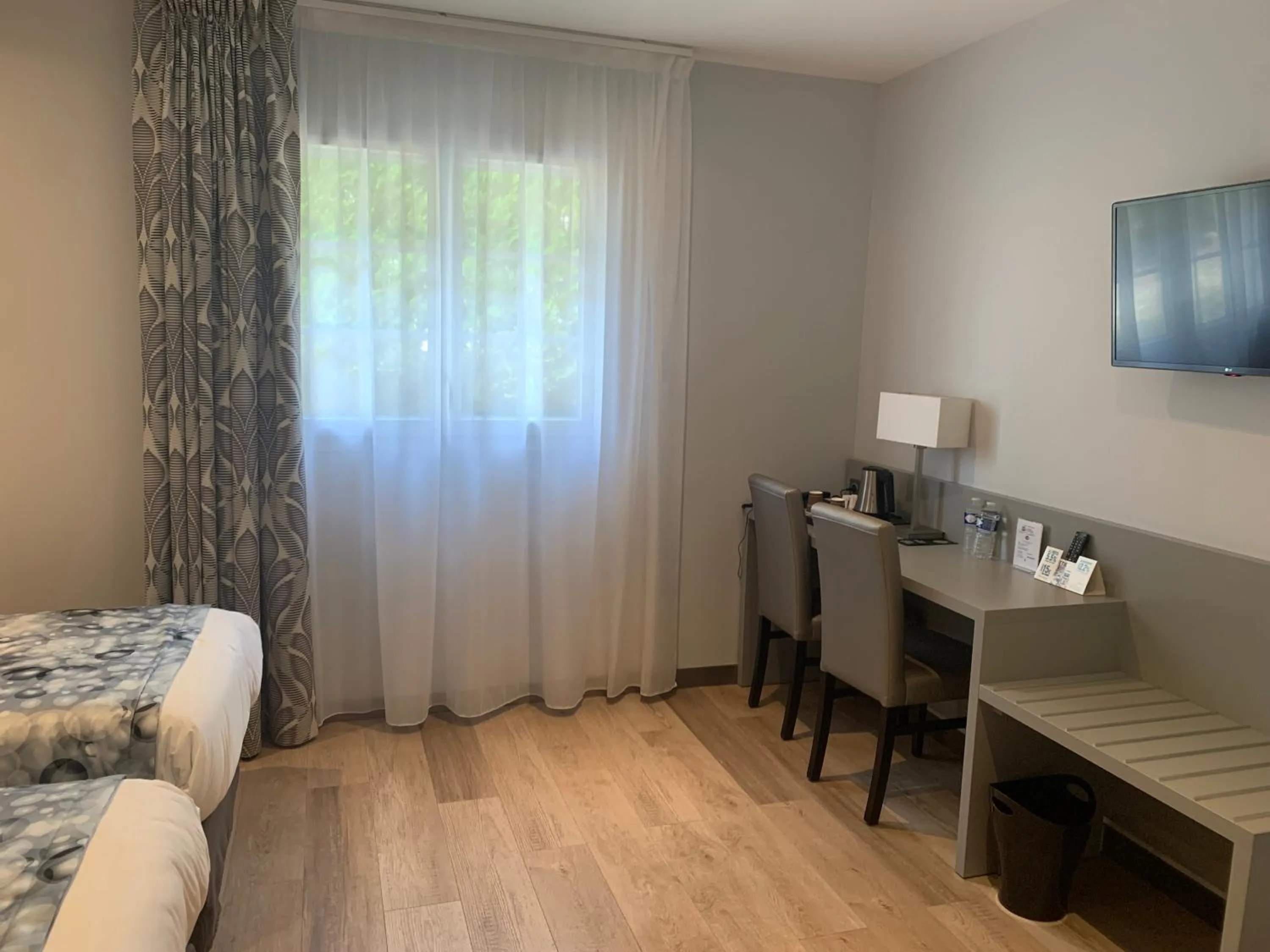 Photo of the whole room, Bed in Logis Hôtel Restaurant Le Moulin de la Coudre