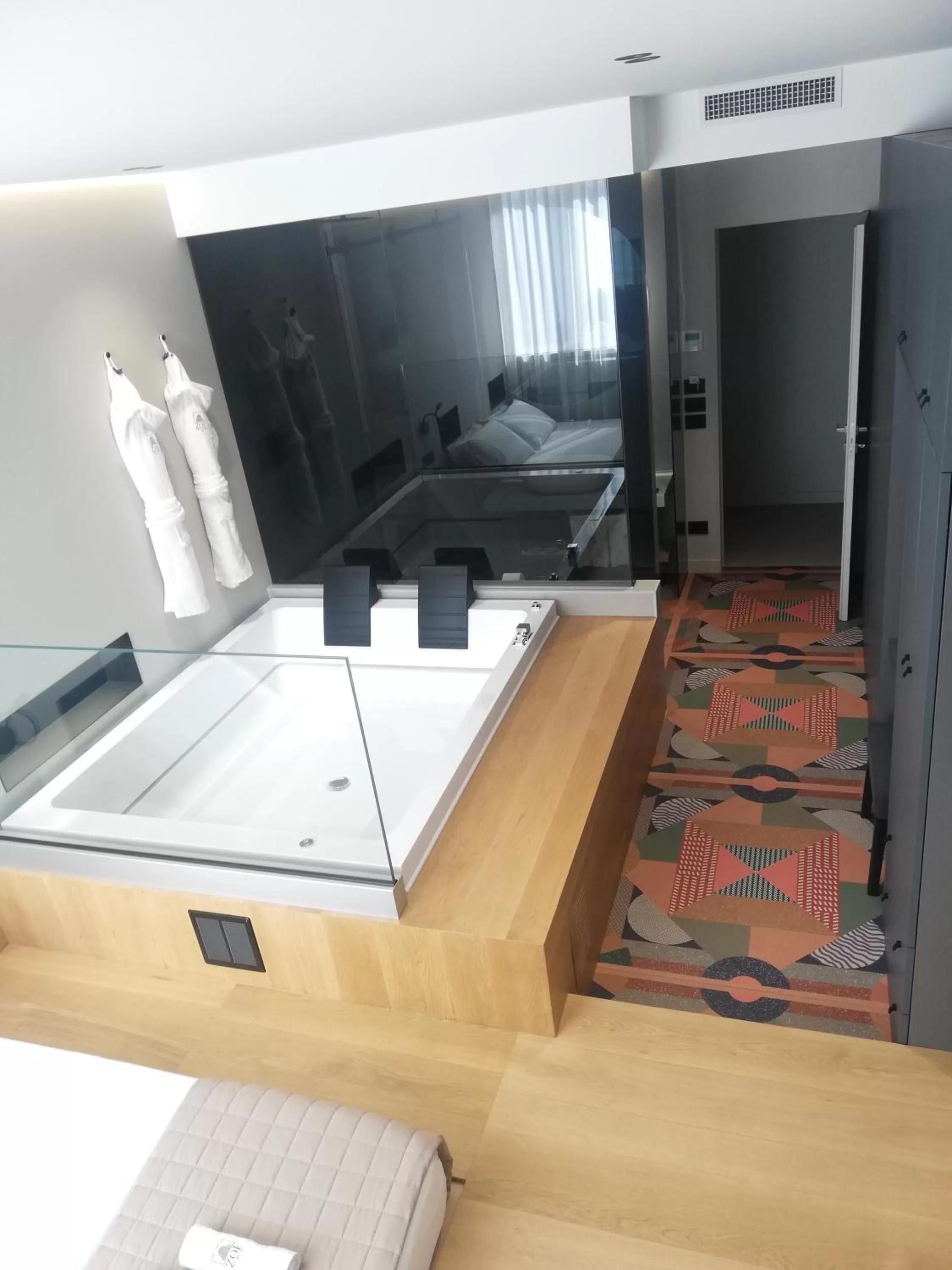 Hot Tub, TV/Entertainment Center in ZOE LUXURY SUITES
