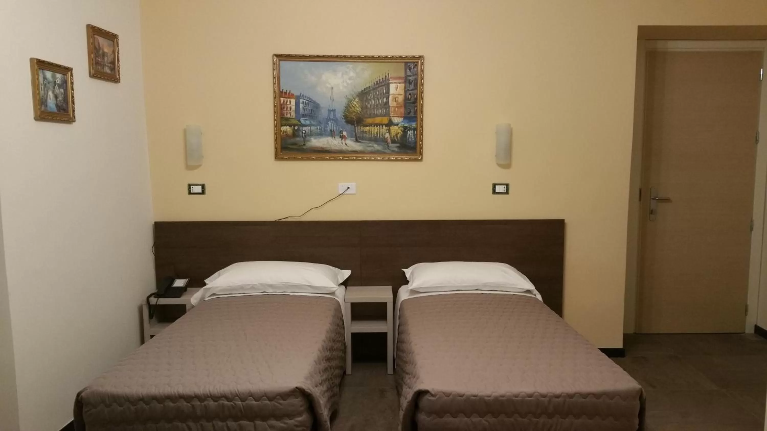 Bed in Hotel Tommaseo