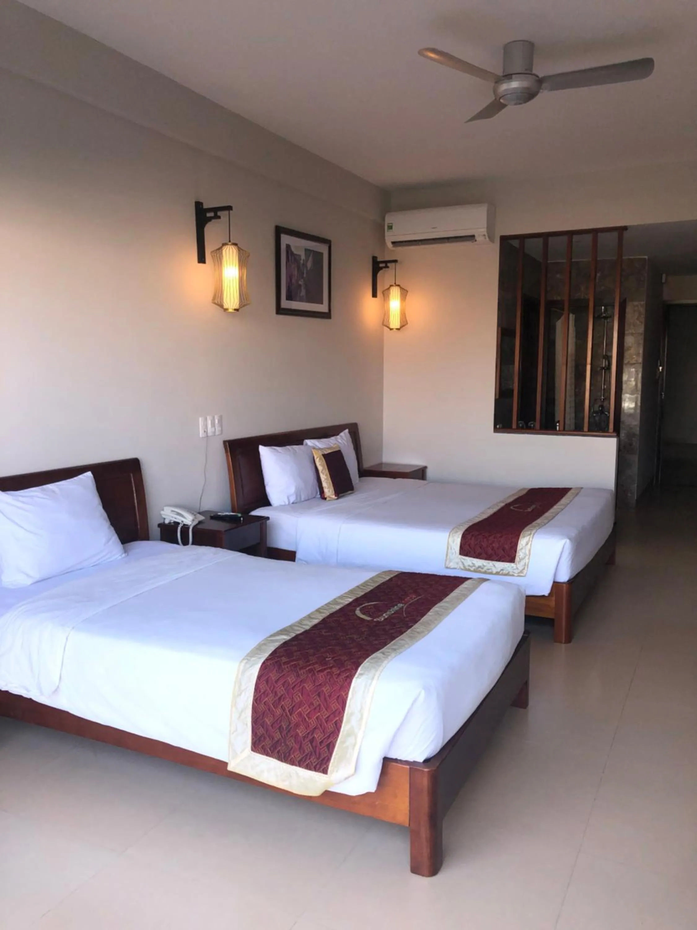 Bed in Sunshine Hoian Hotel