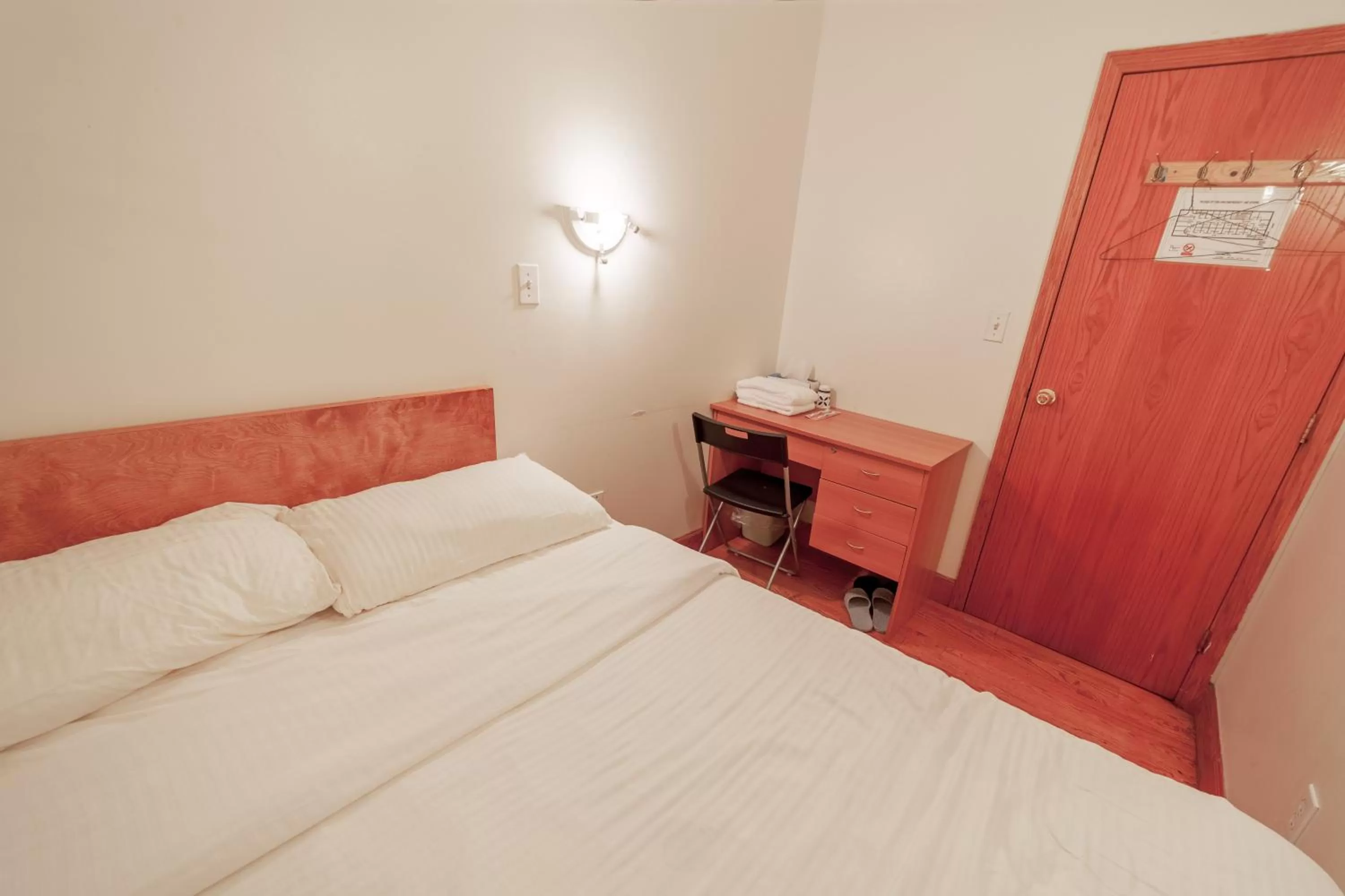 Bed in U.S. Pacific Hotel