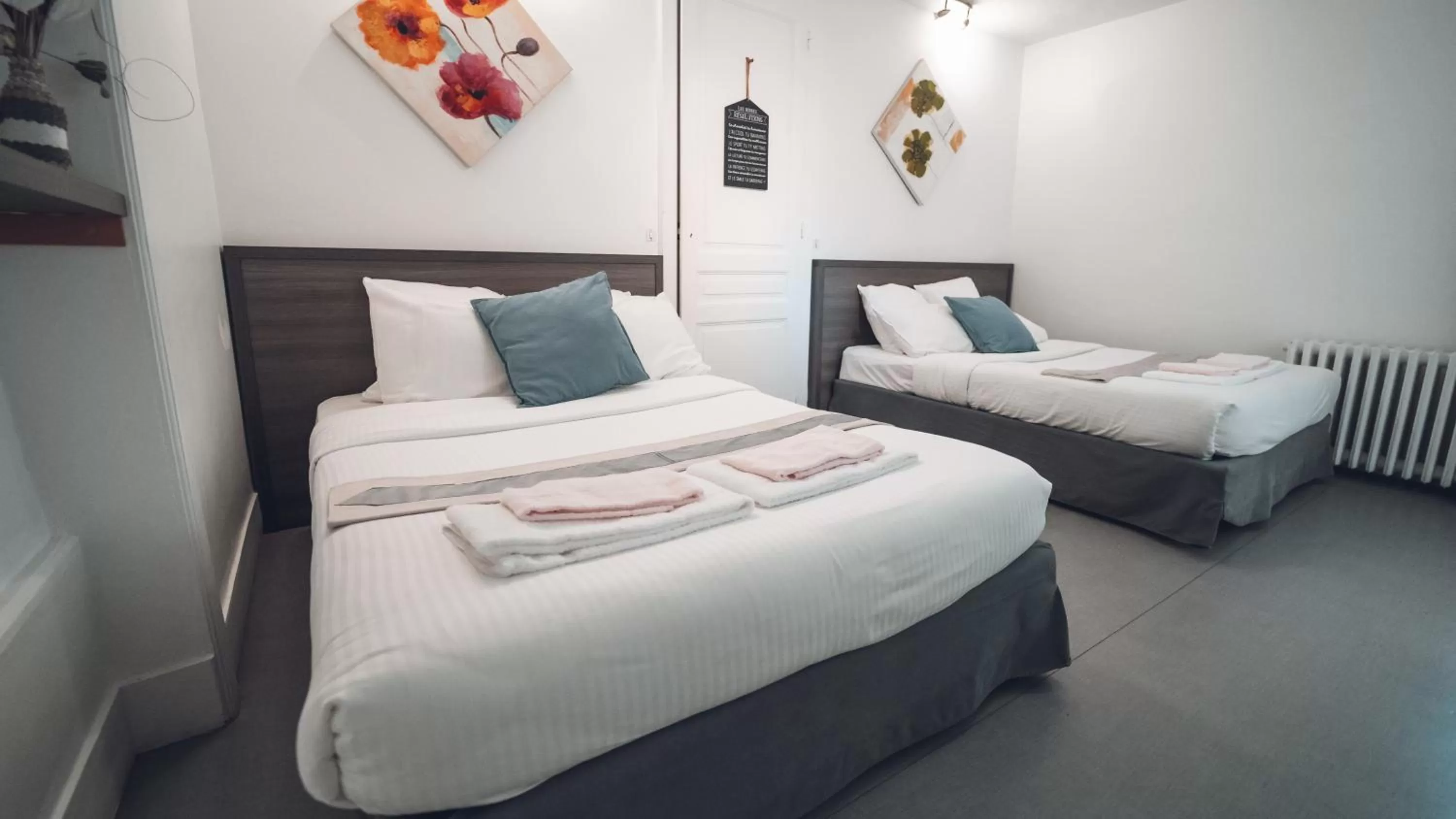 Bed in Logis Hôtel Vuillot