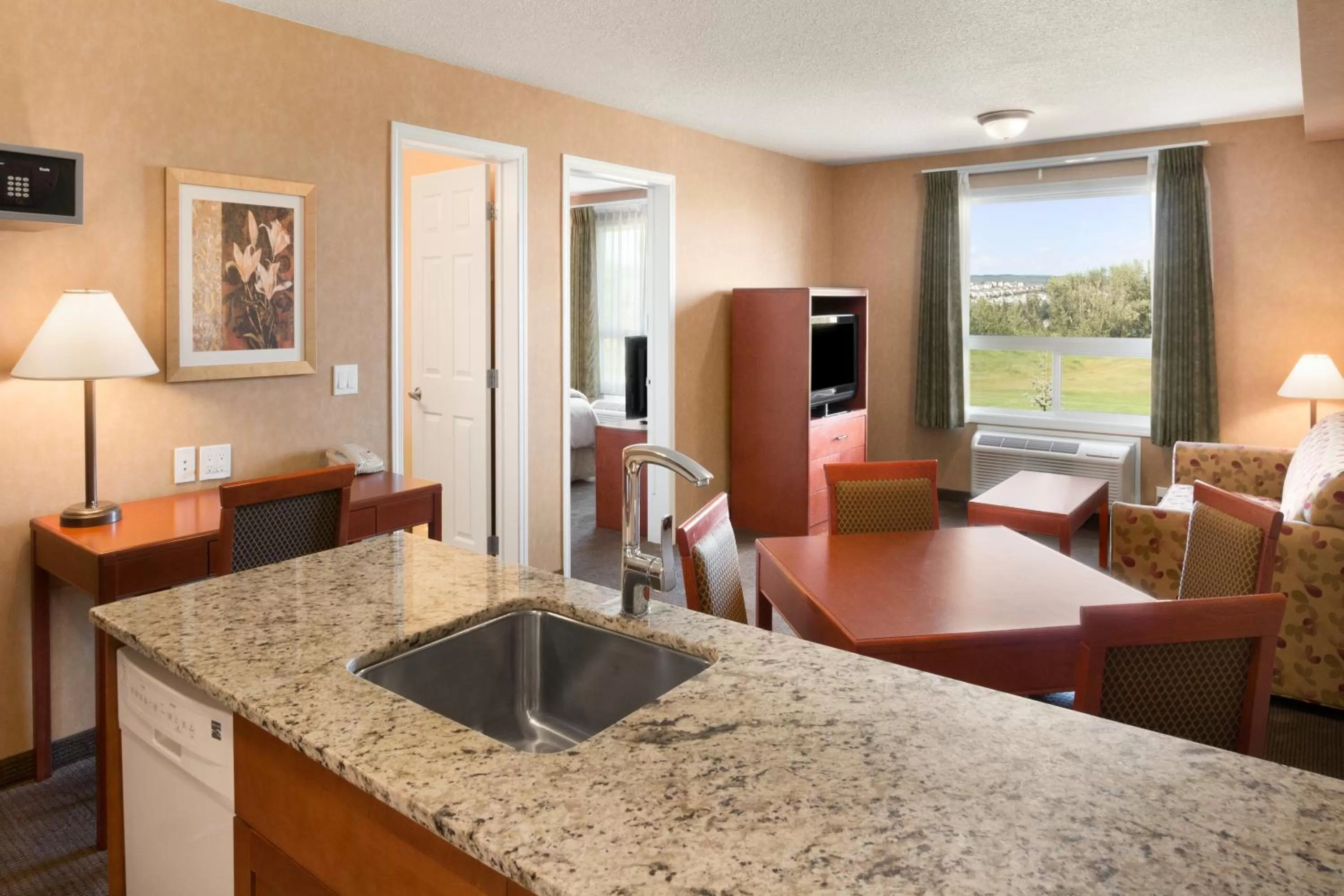 TV and multimedia in Days Inn & Suites by Wyndham Cochrane