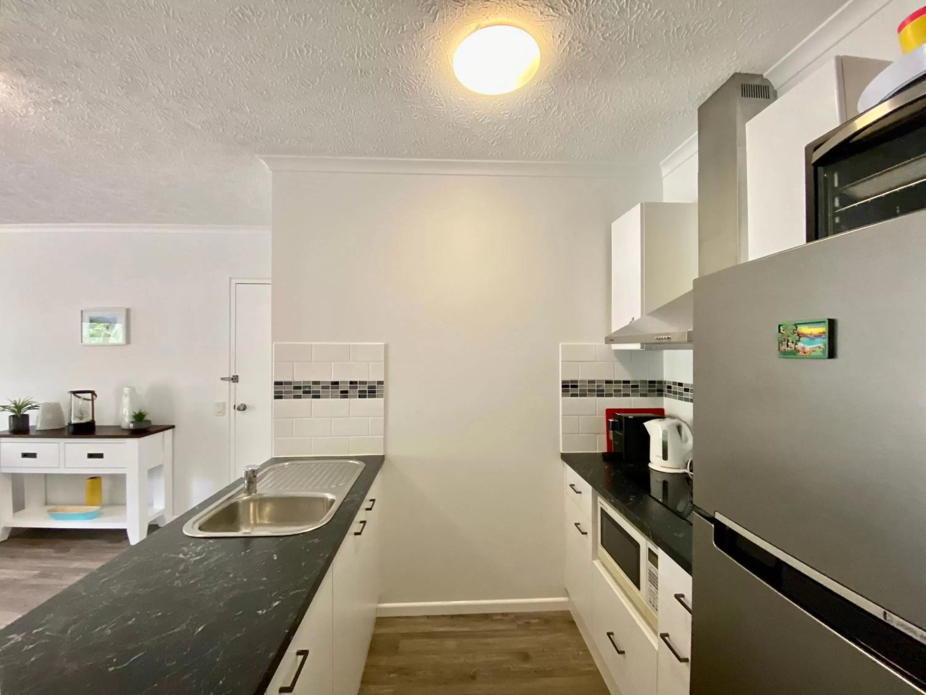 Kitchen or kitchenette in Cairns Beach Resort