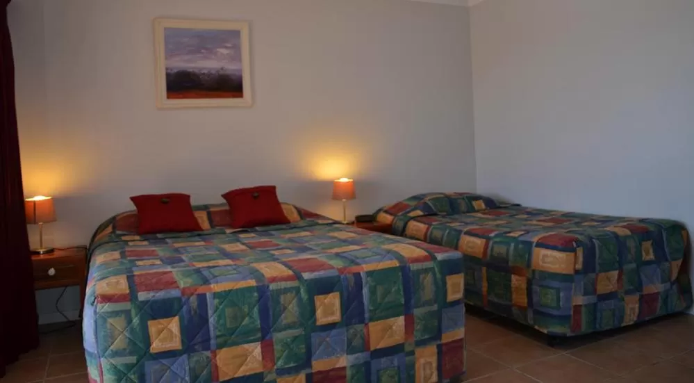 Bed in Tweed River Motel