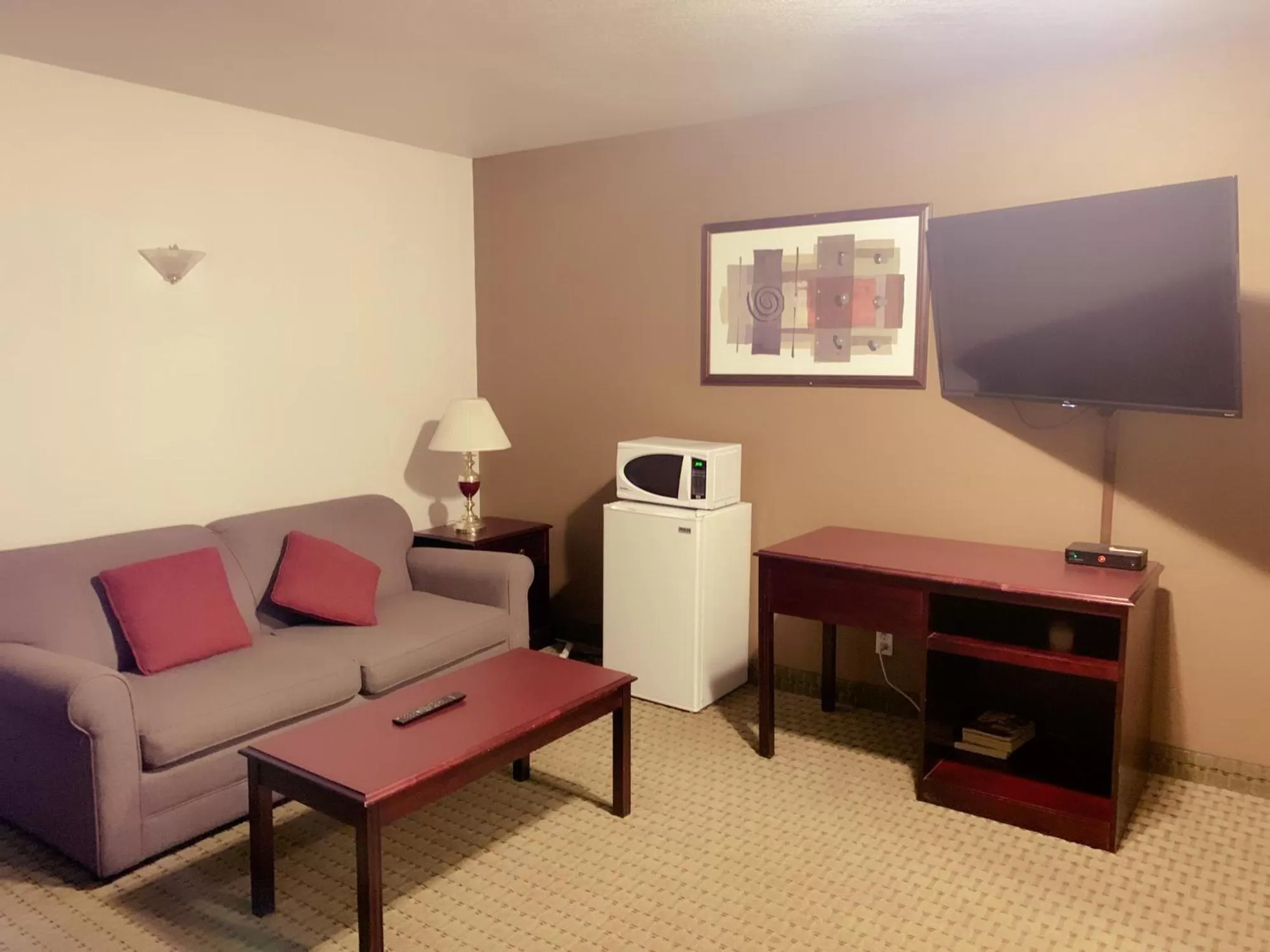 Living room in Ramada by Wyndham Red Deer Hotel & Suites