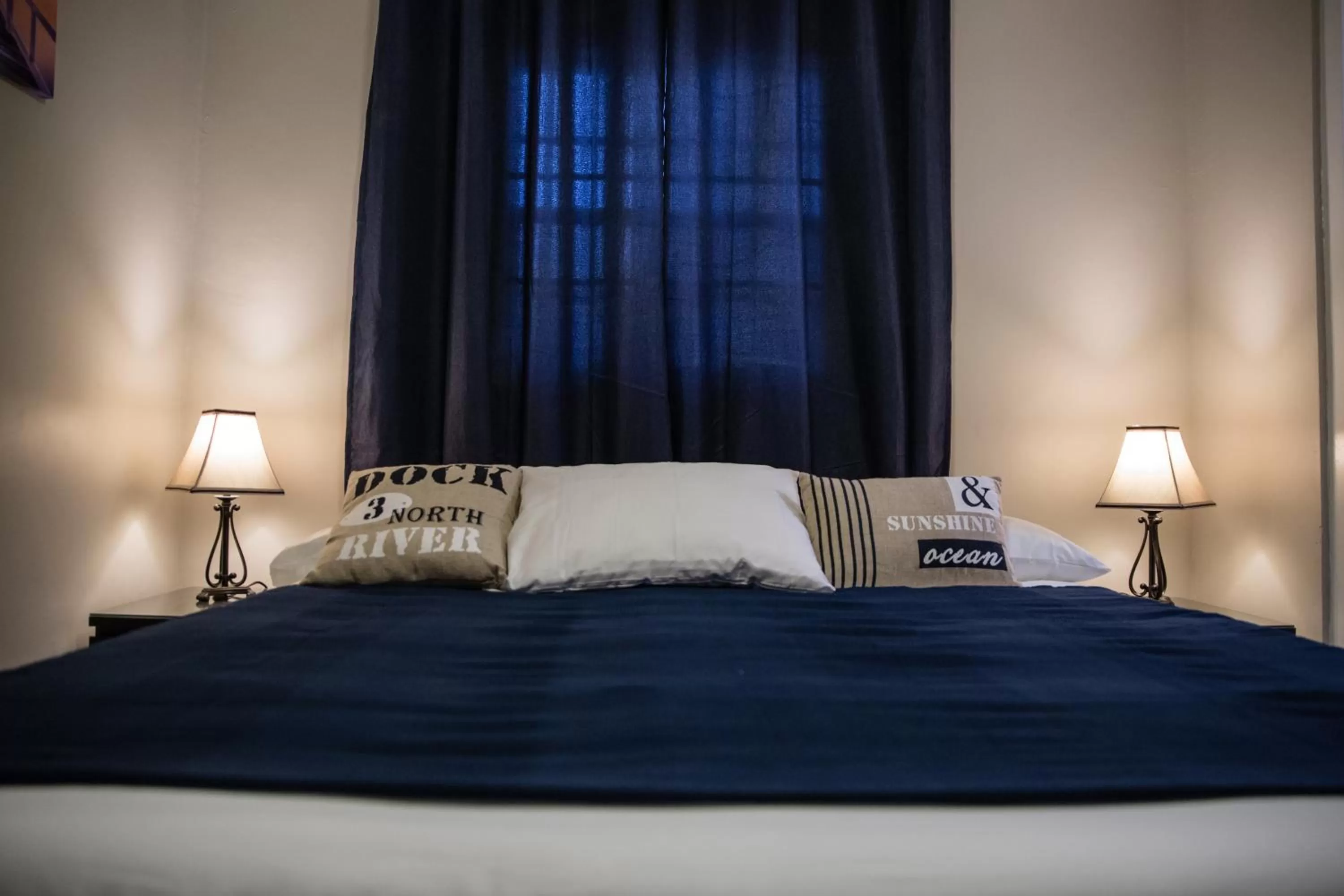 Bed in The Pier Beach Inn & Suites