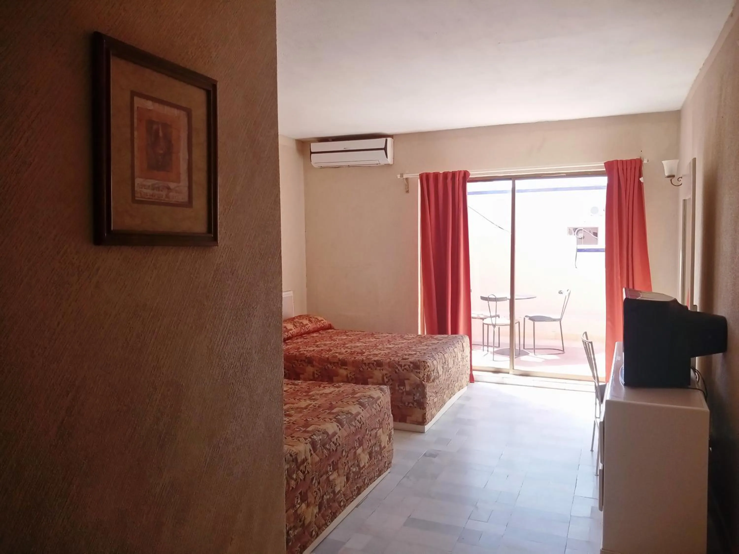 Bed in Los Jitos Hotel & Suites