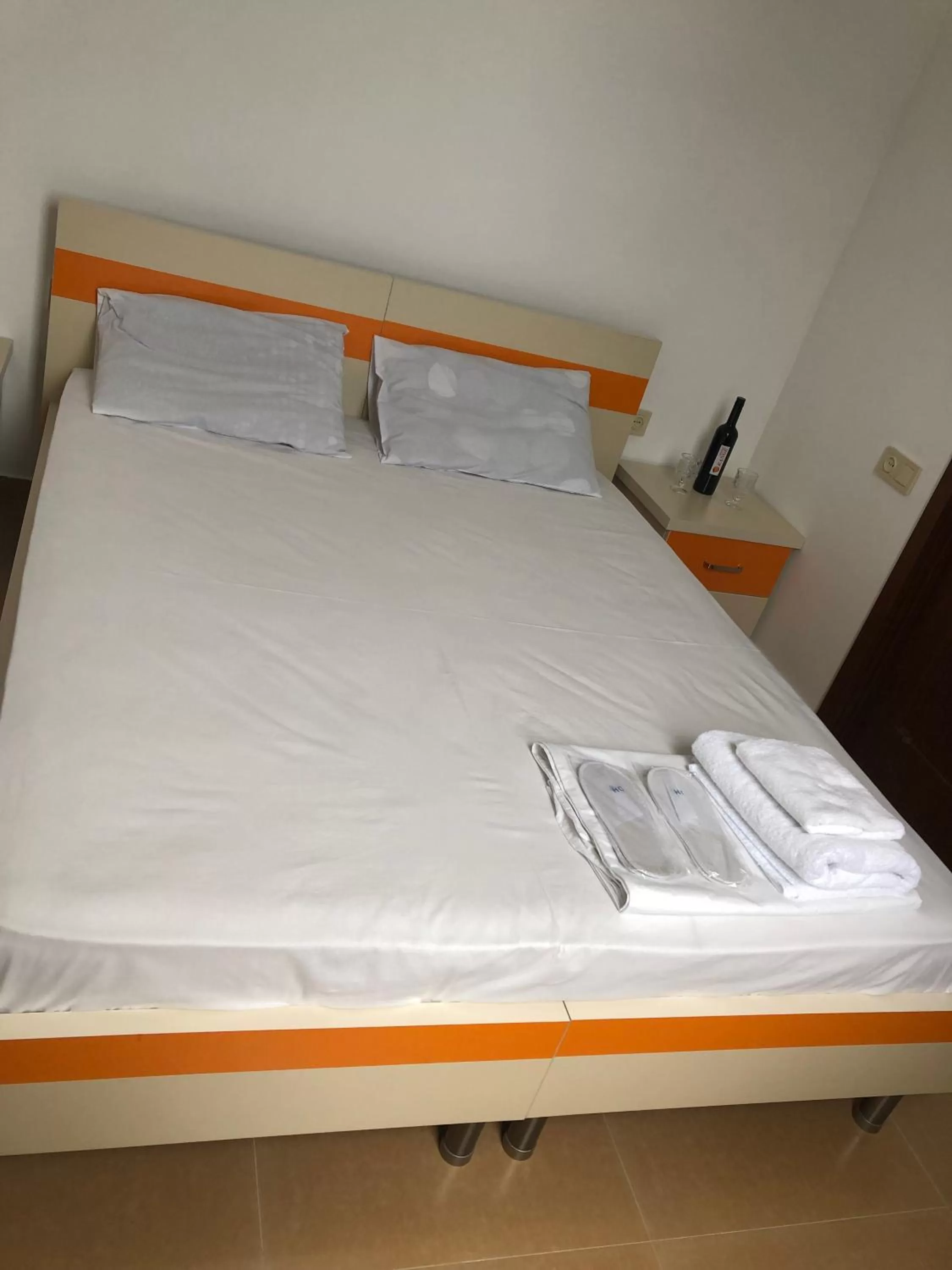 Bed in Orange Home Hotel
