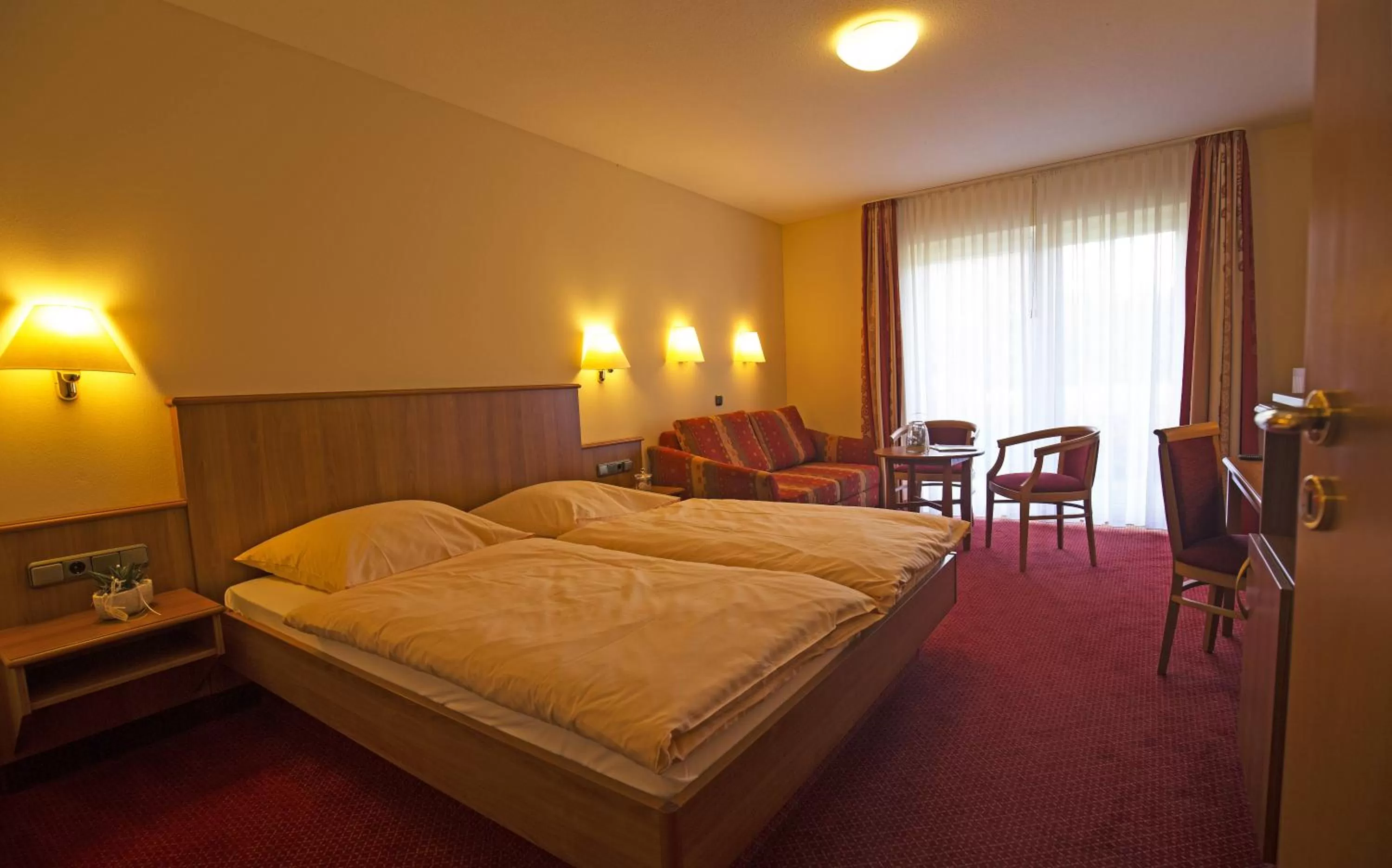 Photo of the whole room, Bed in Hotel Wittensee Schützenhof