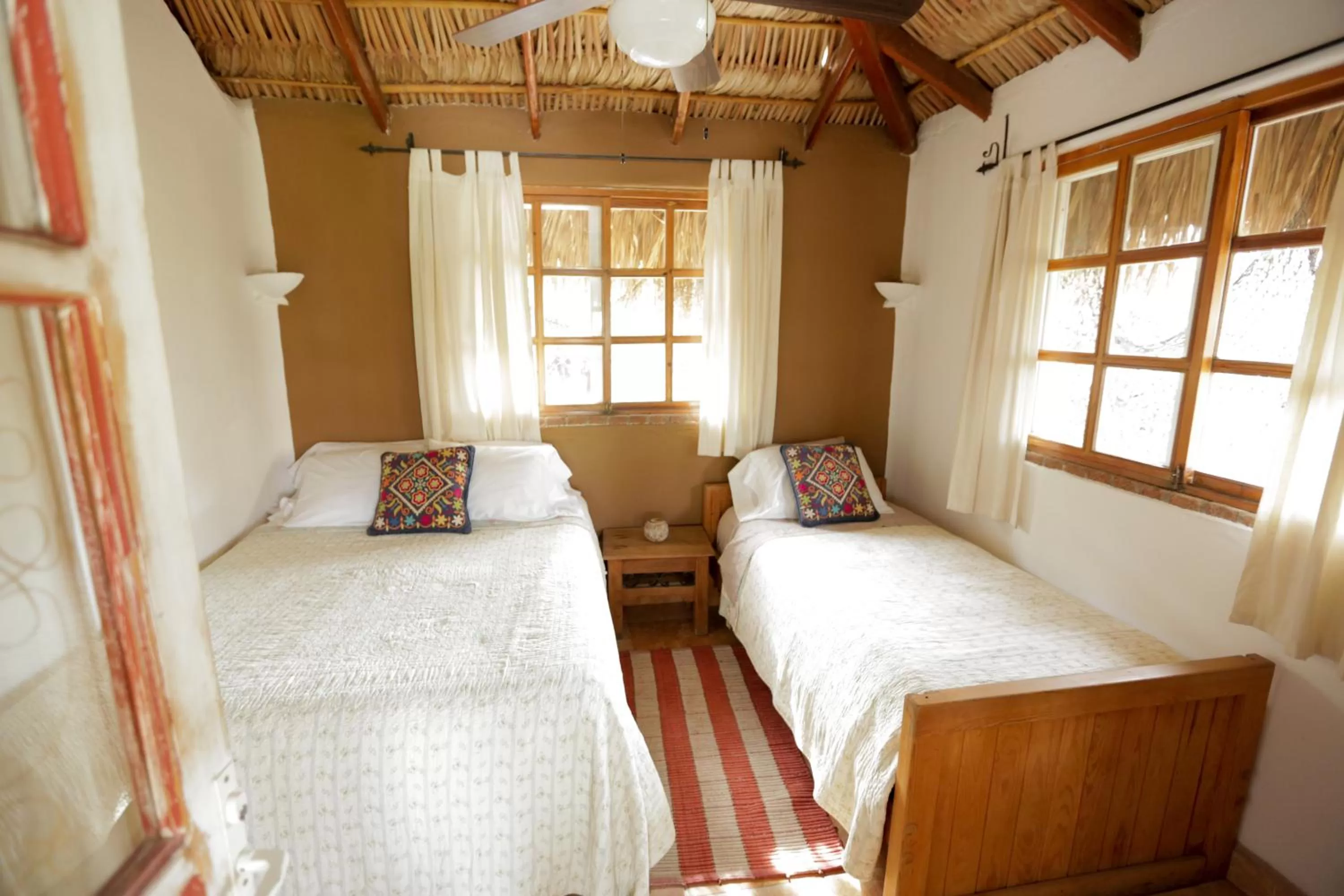 Bed in The Bungalows Hotel