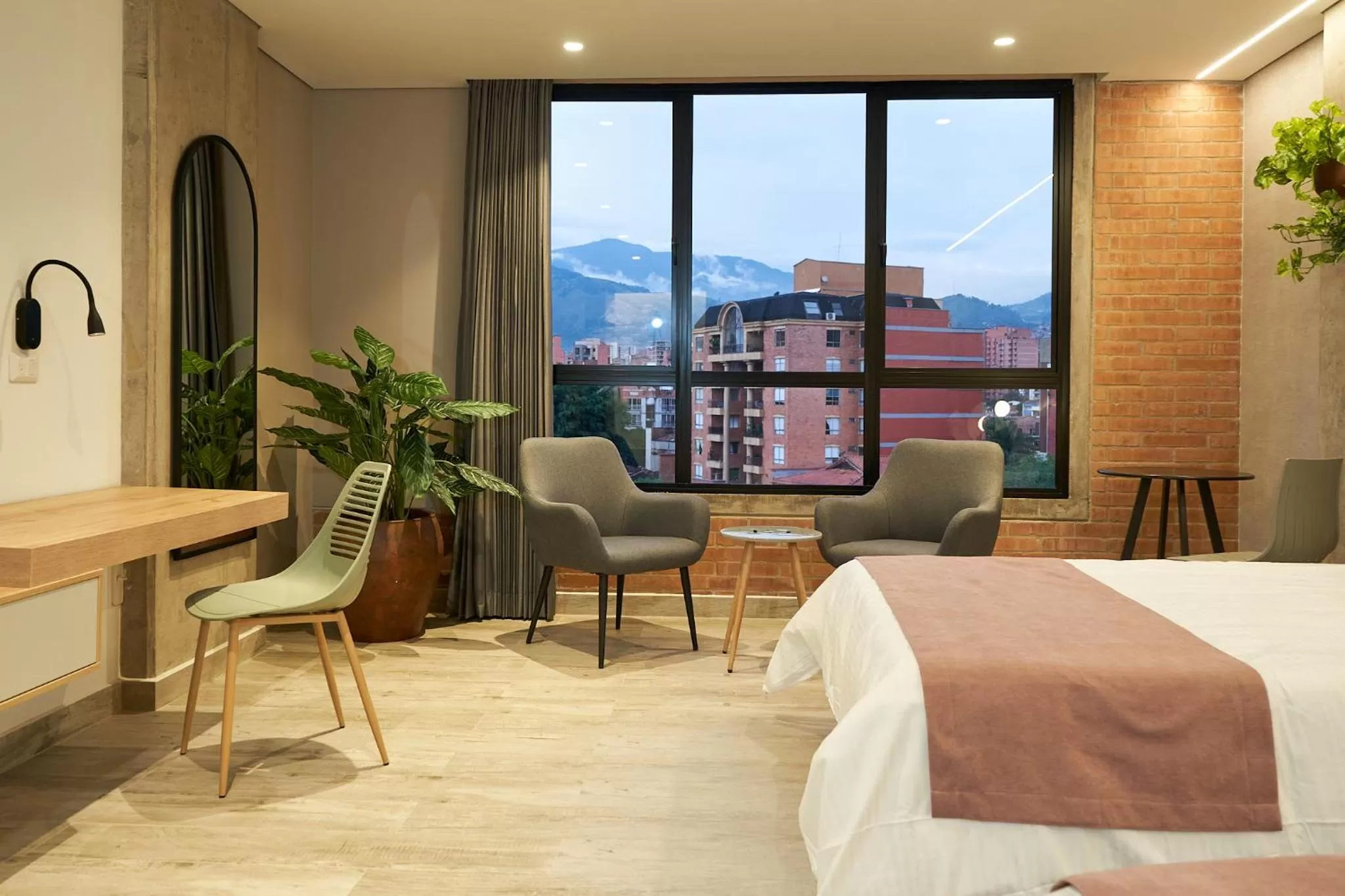 Seating area, Bed in Eutopiq Hotel