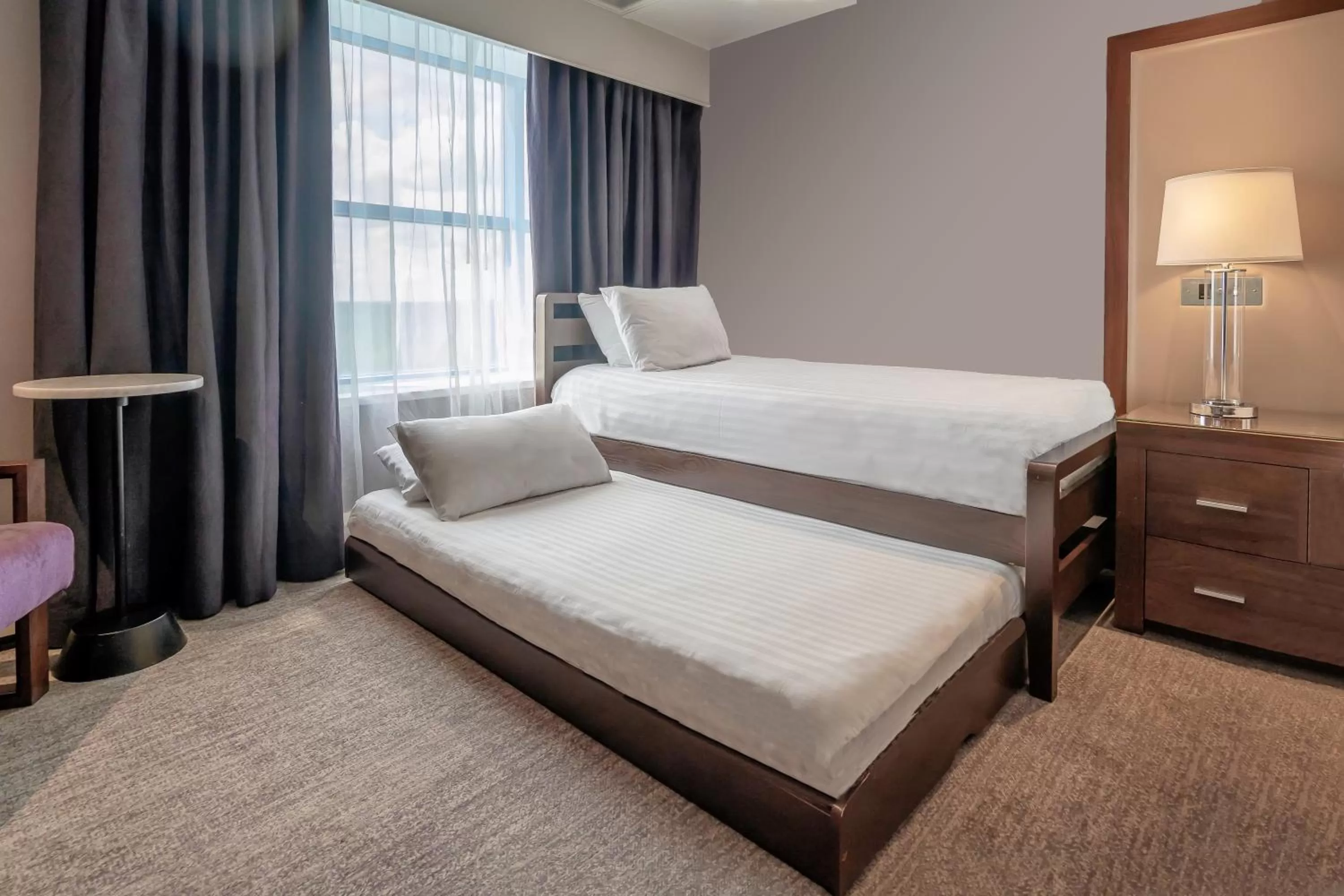 Bed in Sandman Signature London Gatwick Hotel
