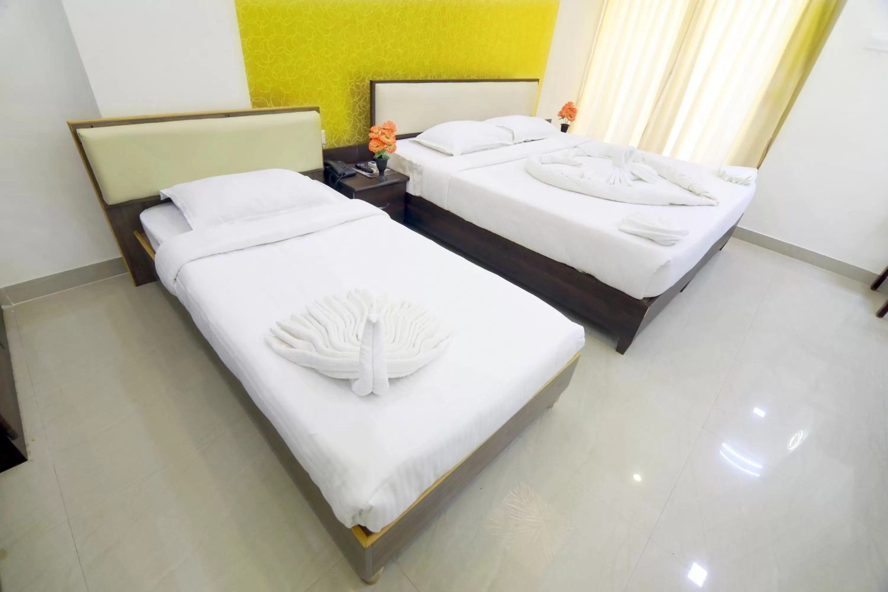 Bed in Hotel Ambai Grand