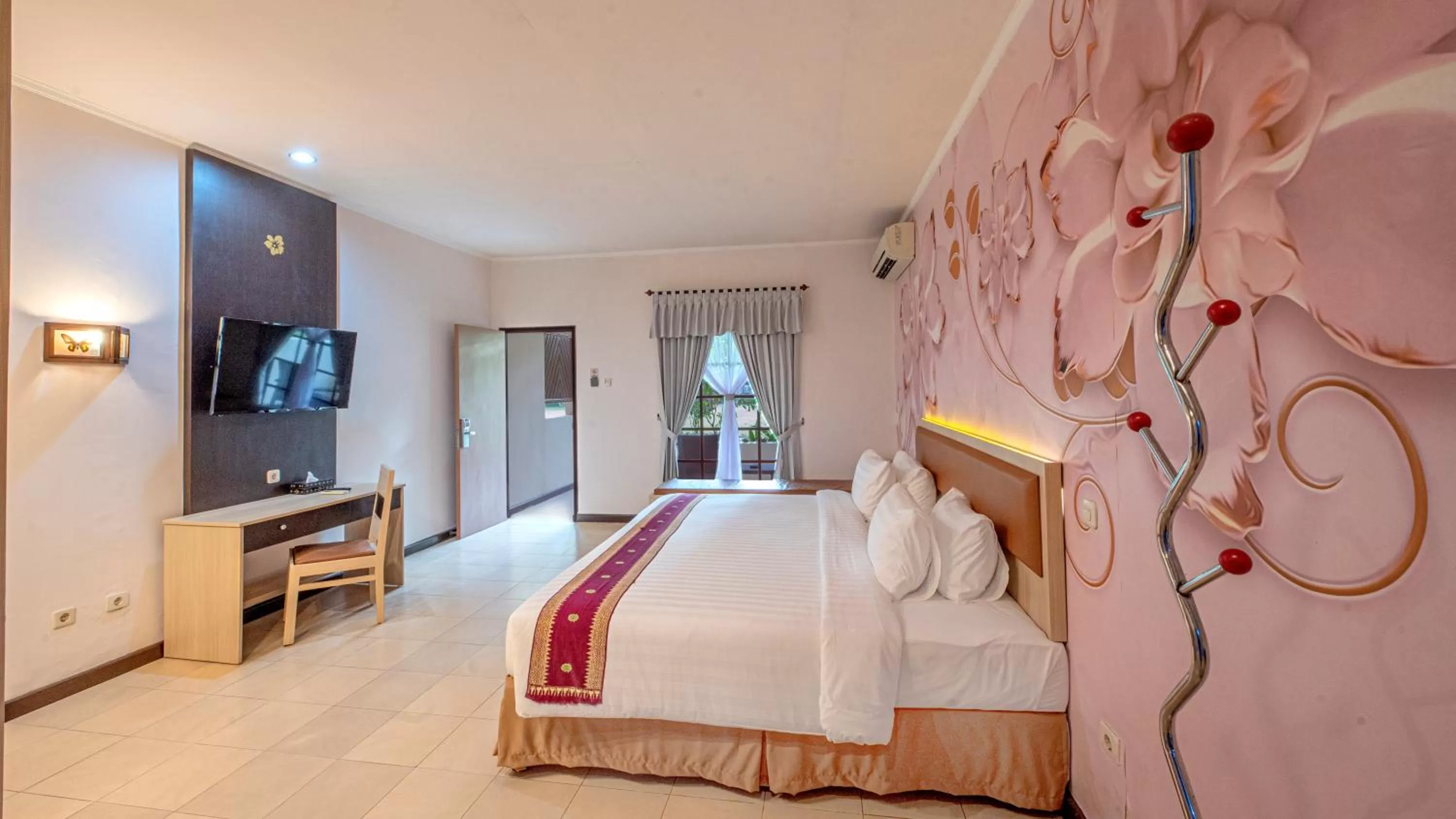 Communal lounge/ TV room, Bed in Lombok Garden Hotel