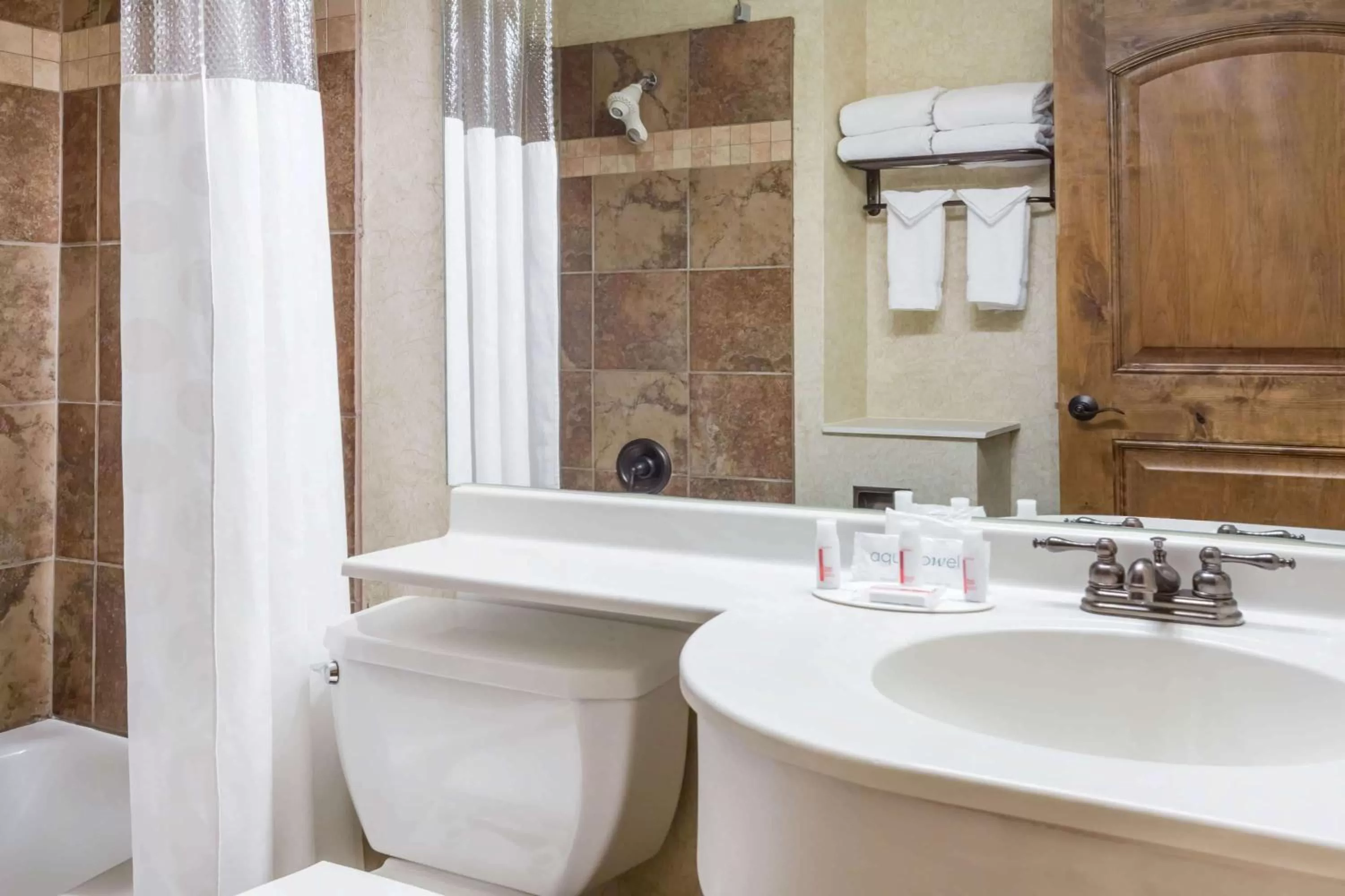 Bathroom in Ramada by Wyndham Frisco
