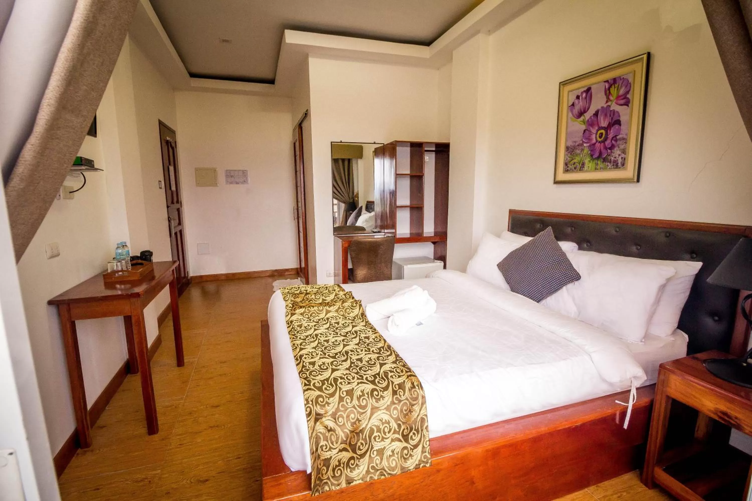 Bed in El Nido Royal Palm Inn