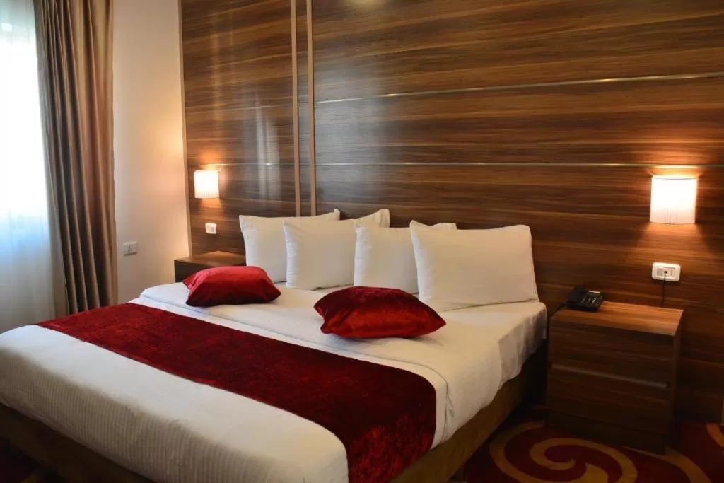 Bed in Spark Plaza Hotel