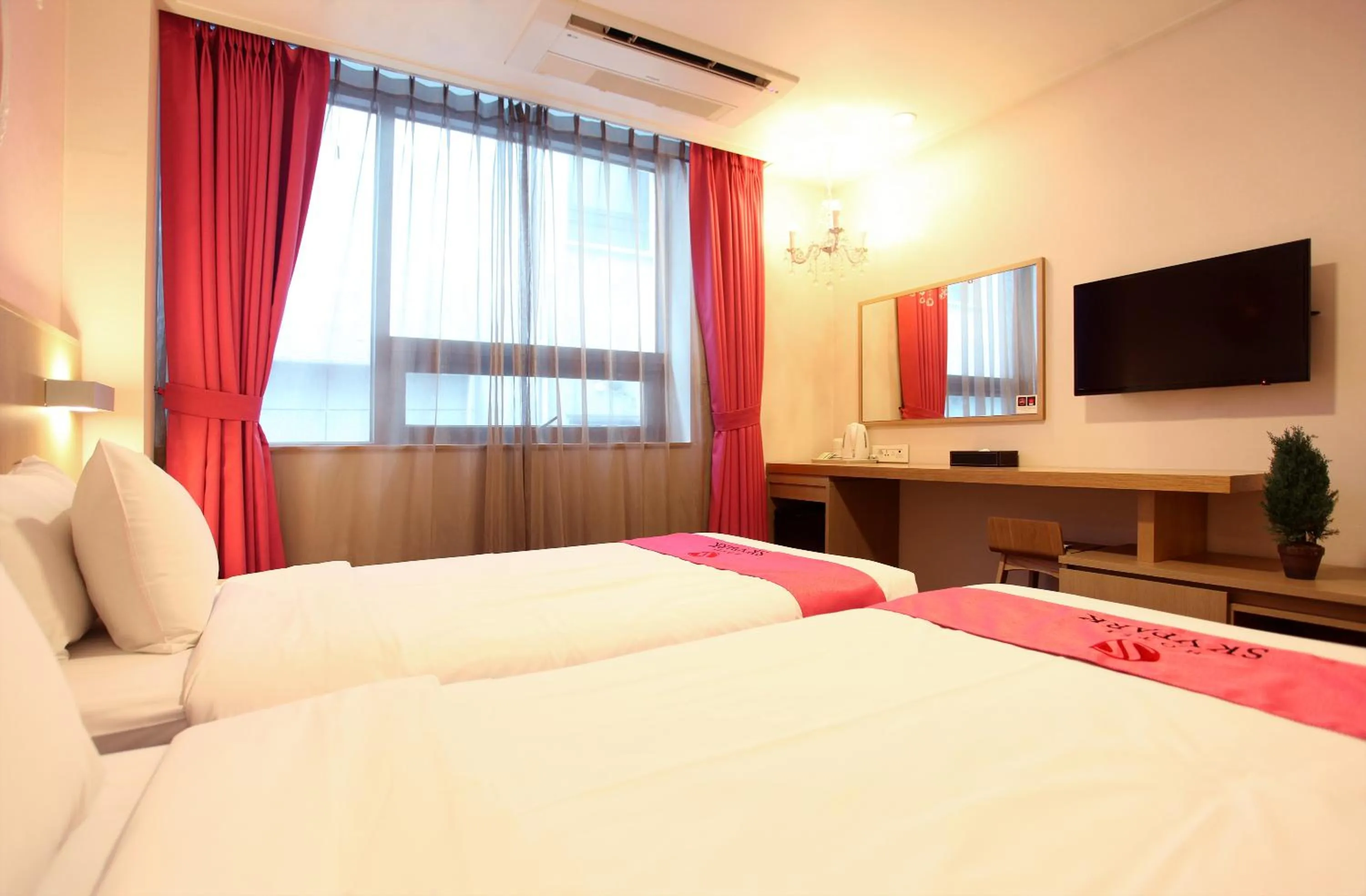 Bedroom, Bed in Hotel Skypark Jeju 1 Newly renovated