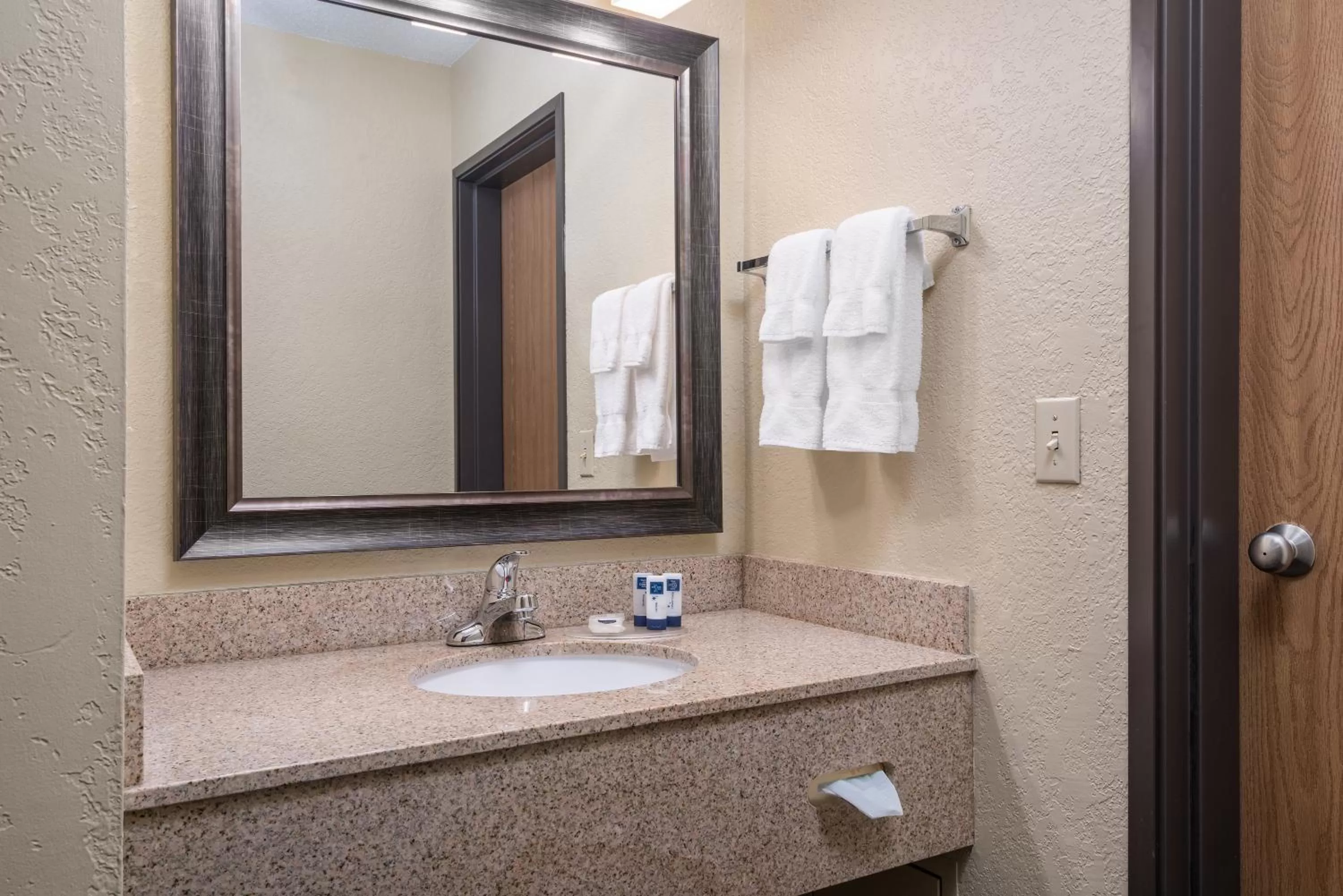 Bathroom in AmericInn by Wyndham Fargo West Acres
