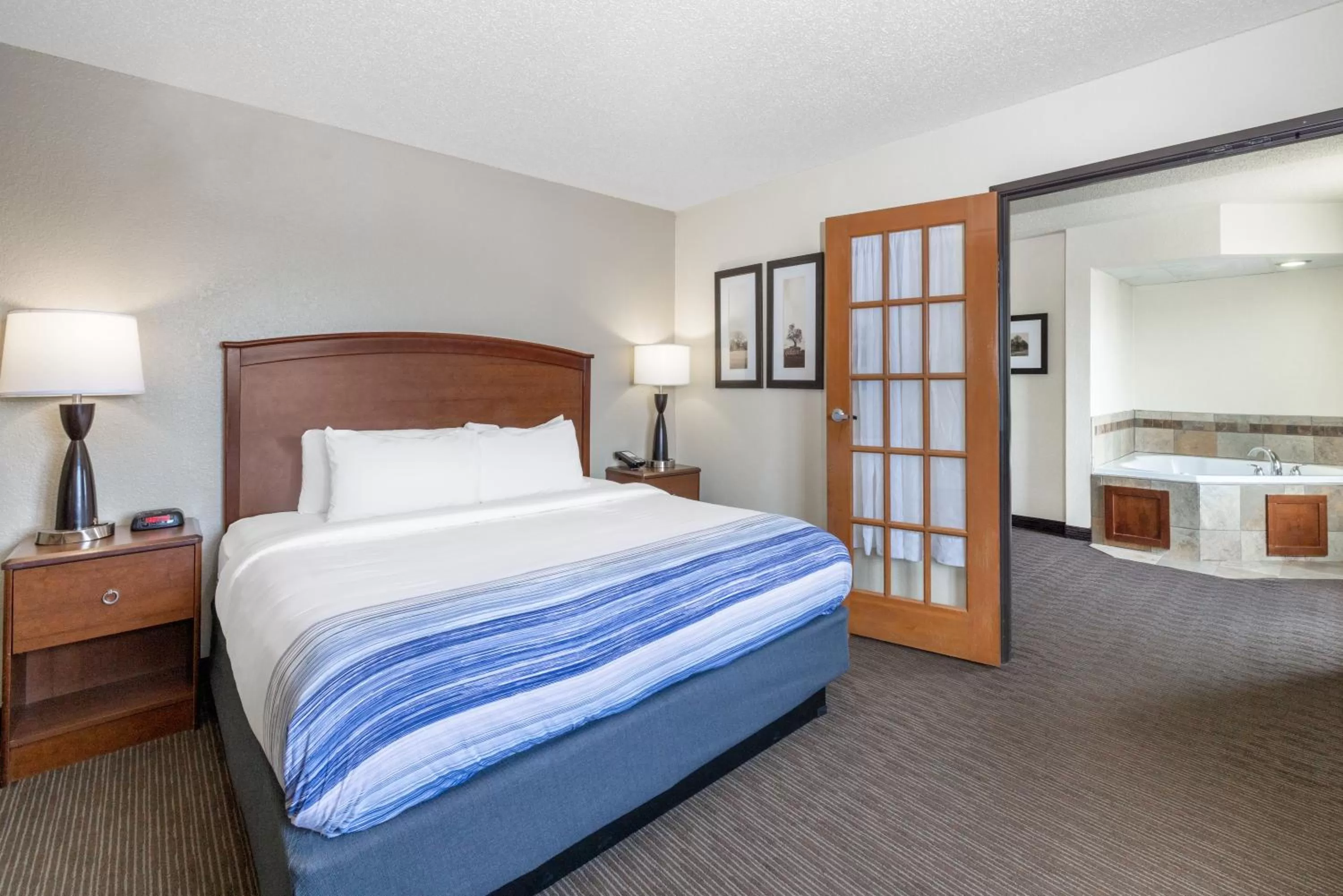 Photo of the whole room, Bed in AmericInn by Wyndham Dickinson