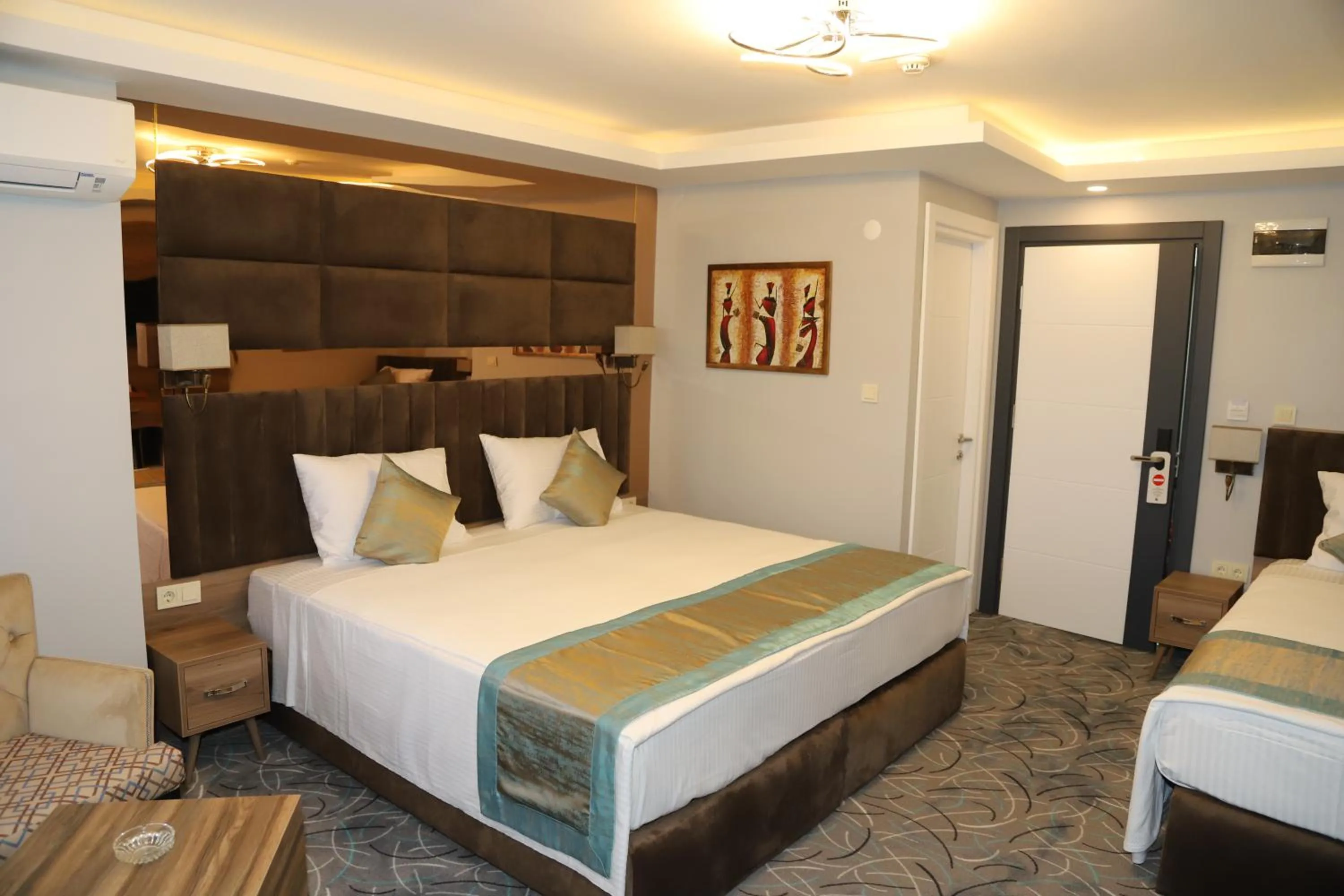 Bed in Grand Kavi Hotel