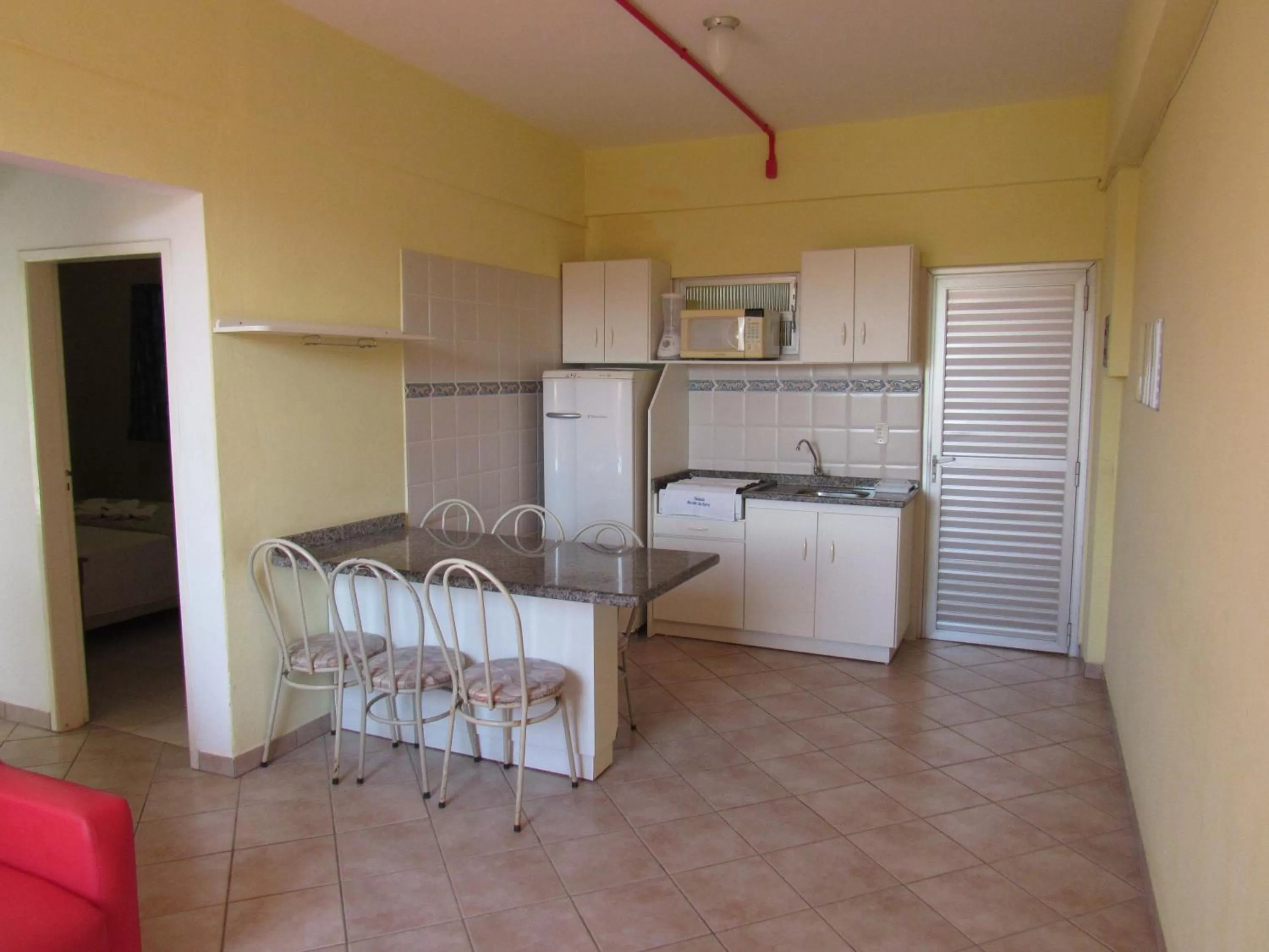 Kitchen or kitchenette in Pousada Recanto da Barra