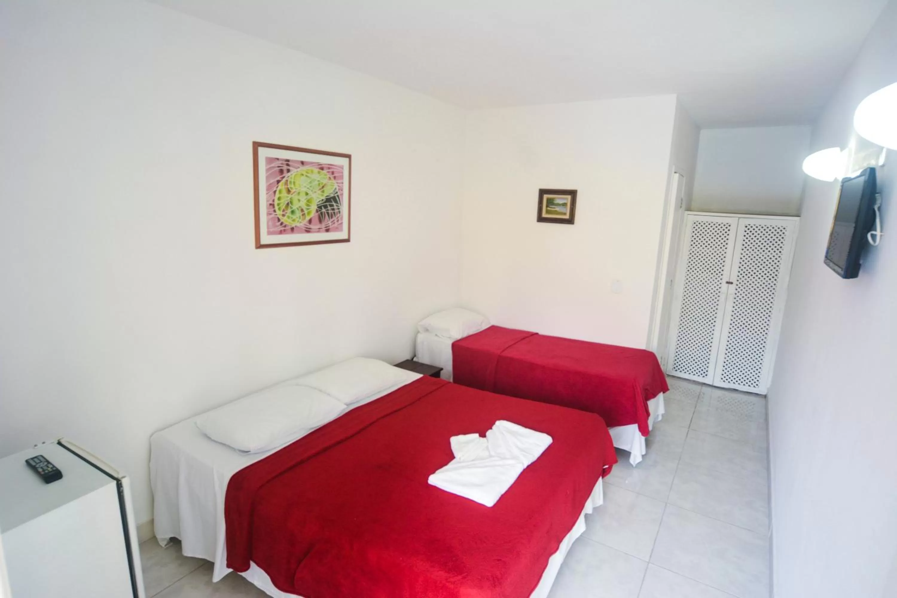 Bed in Pousada Estrela de Paraty