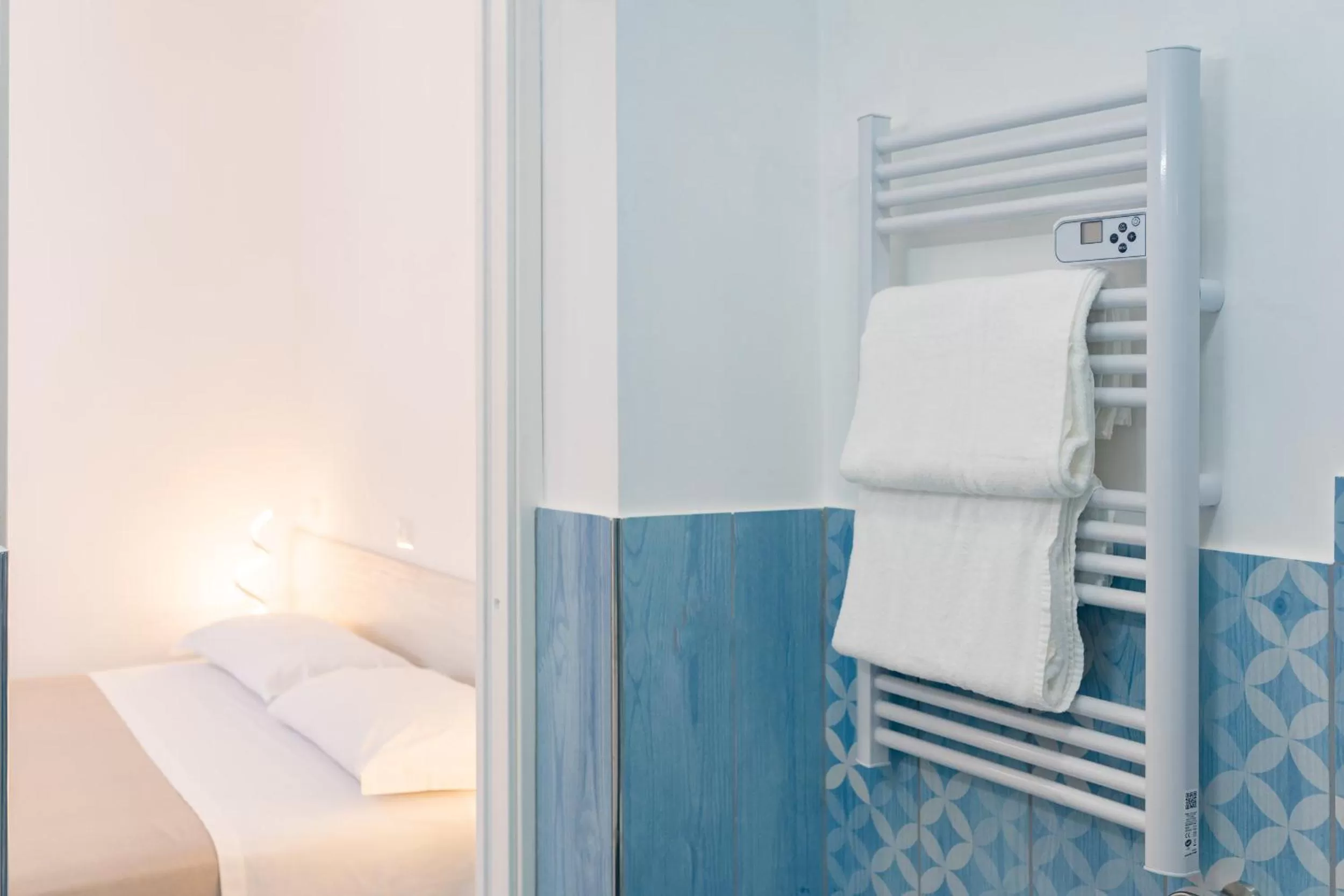 Bed in Poseidonia Rooms