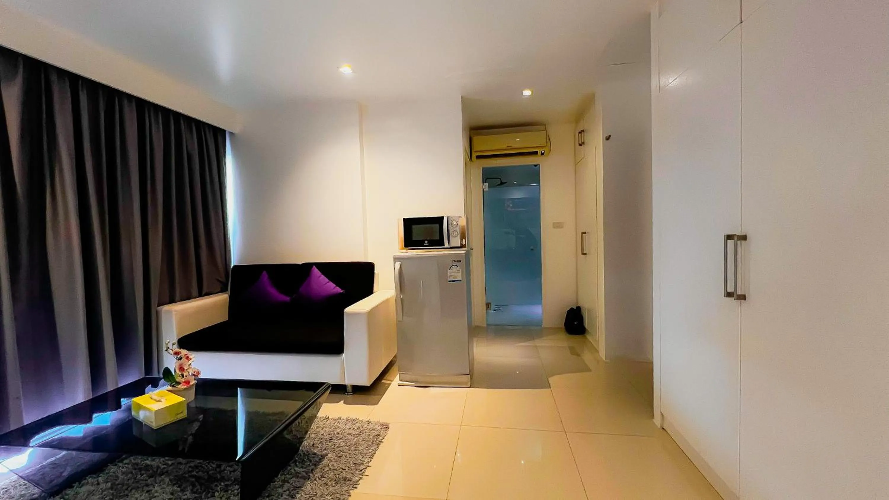 Living room, Bed in Grand Sunset Hotel Phuket