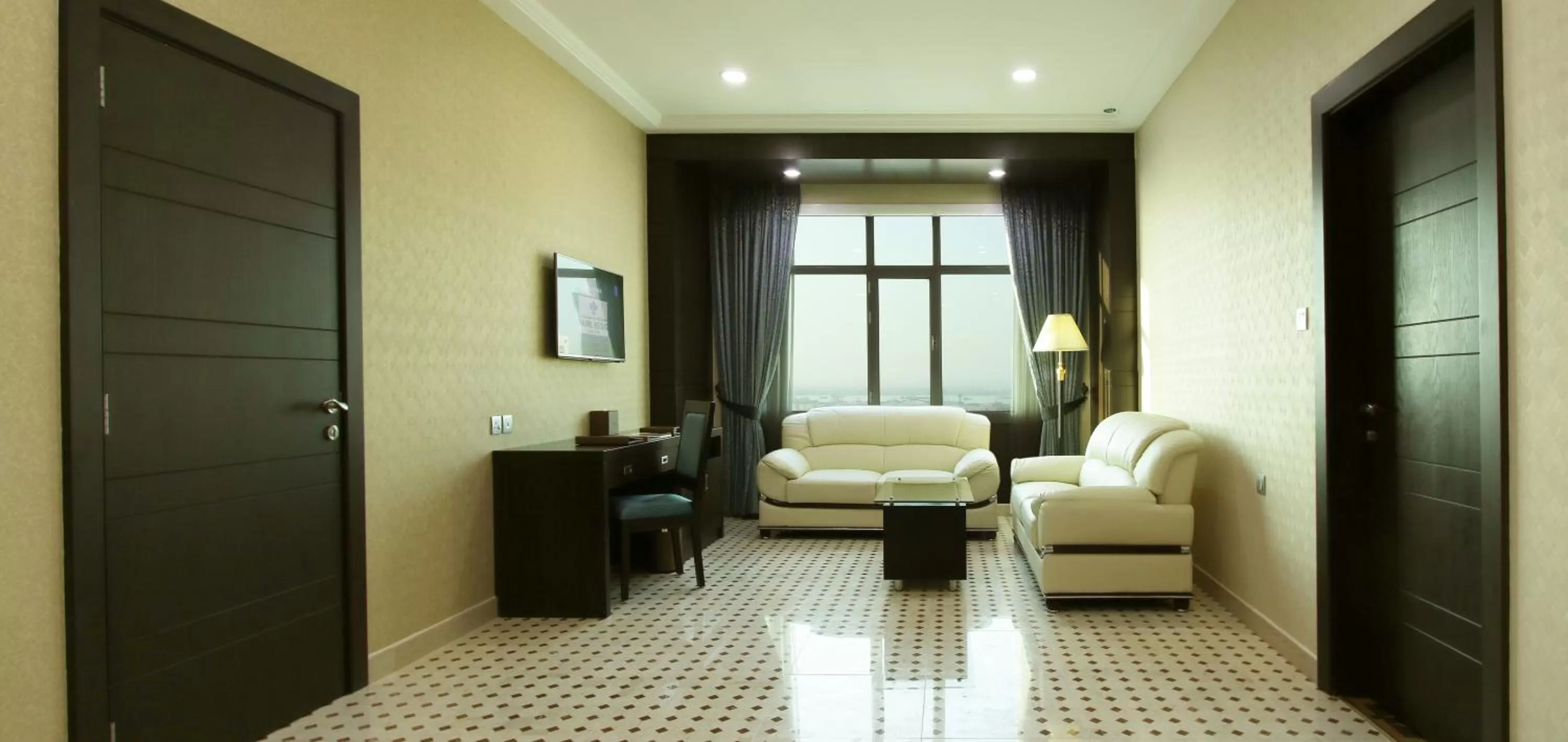 Living room in Park Regis Lotus Hotel